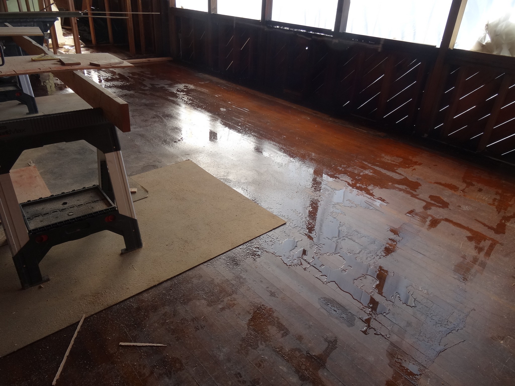 No roof, no windows and a rain storm ruined the hardwood flooring