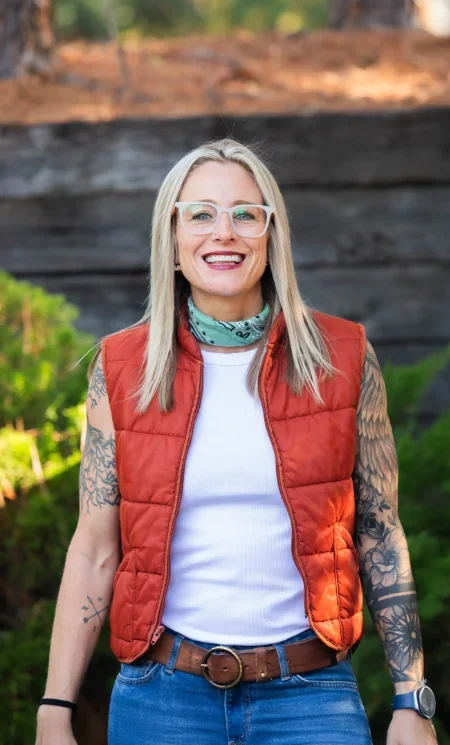 Iron City Counseling therapist standing outdoors, smiling warmly, representing approachable, professional, and compassionate mental health care in Hoover and Birmingham, Alabama.