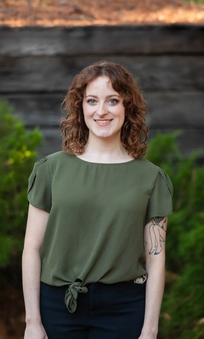 Paige Dixon, licensed therapist at Iron City Counseling in Hoover, Alabama, smiling outdoors and providing thoughtful mental health support for individuals, couples, and families.