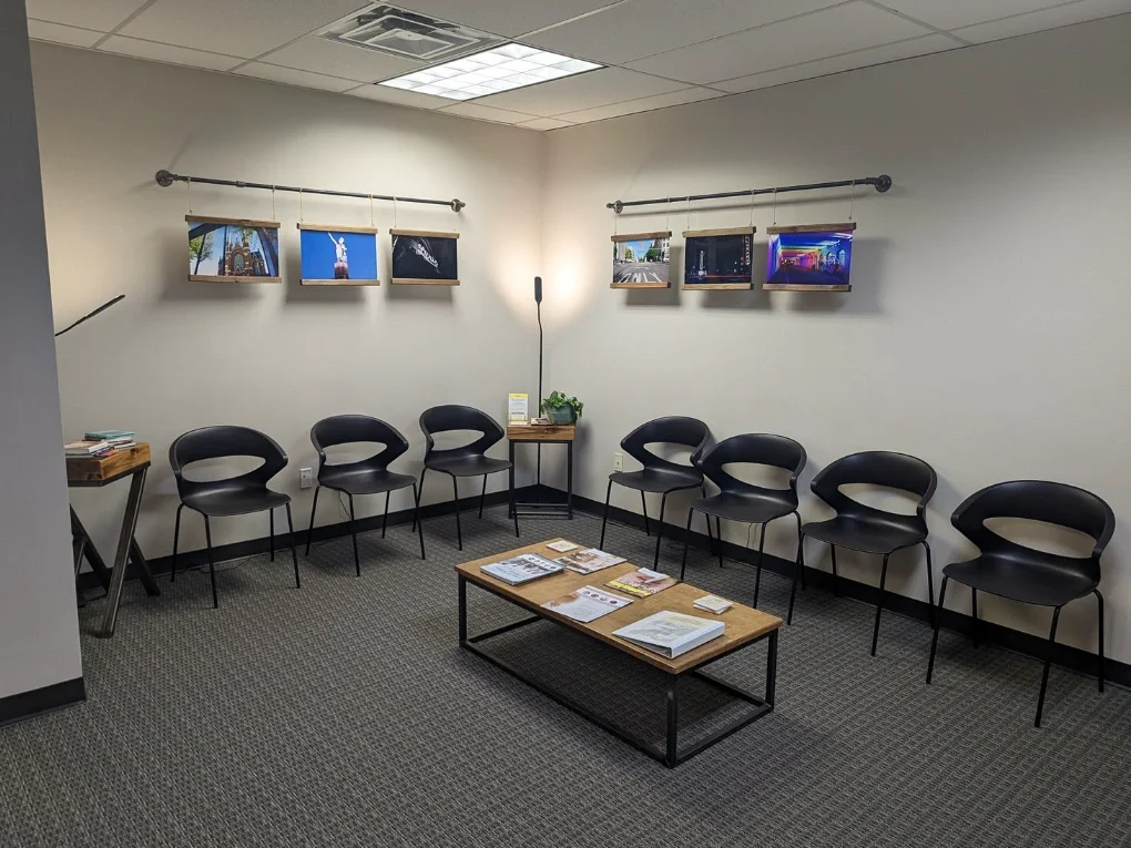 Iron City Counseling waiting area in Hoover, Alabama with seating, framed local artwork, and a welcoming seating layout.