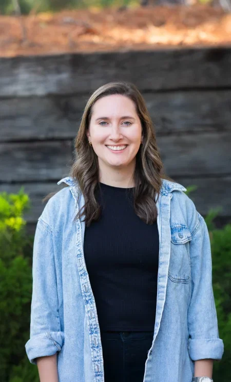 Iron City Counseling therapist standing outdoors and smiling friendly, representing authentic, compassionate mental health counseling services in the Hoover and Birmingham, Alabama area.