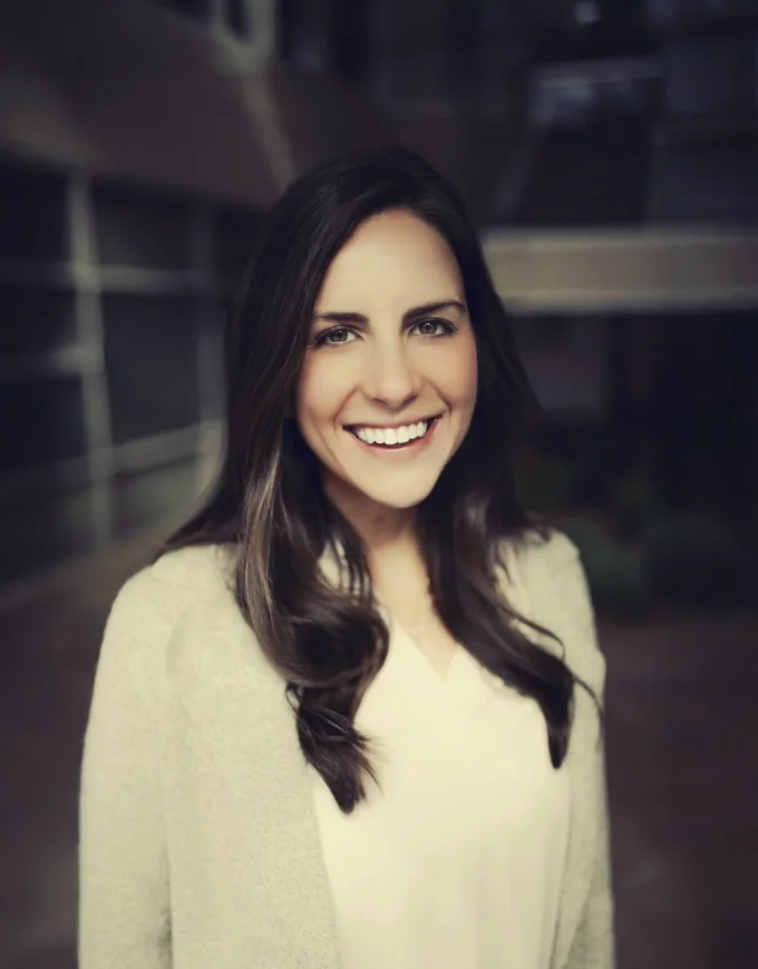 McKenzie Huggins Wheeler, licensed therapist at Iron City Counseling in Hoover, Alabama, smiling in a professional portrait and providing compassionate counseling for individuals, couples, and families.