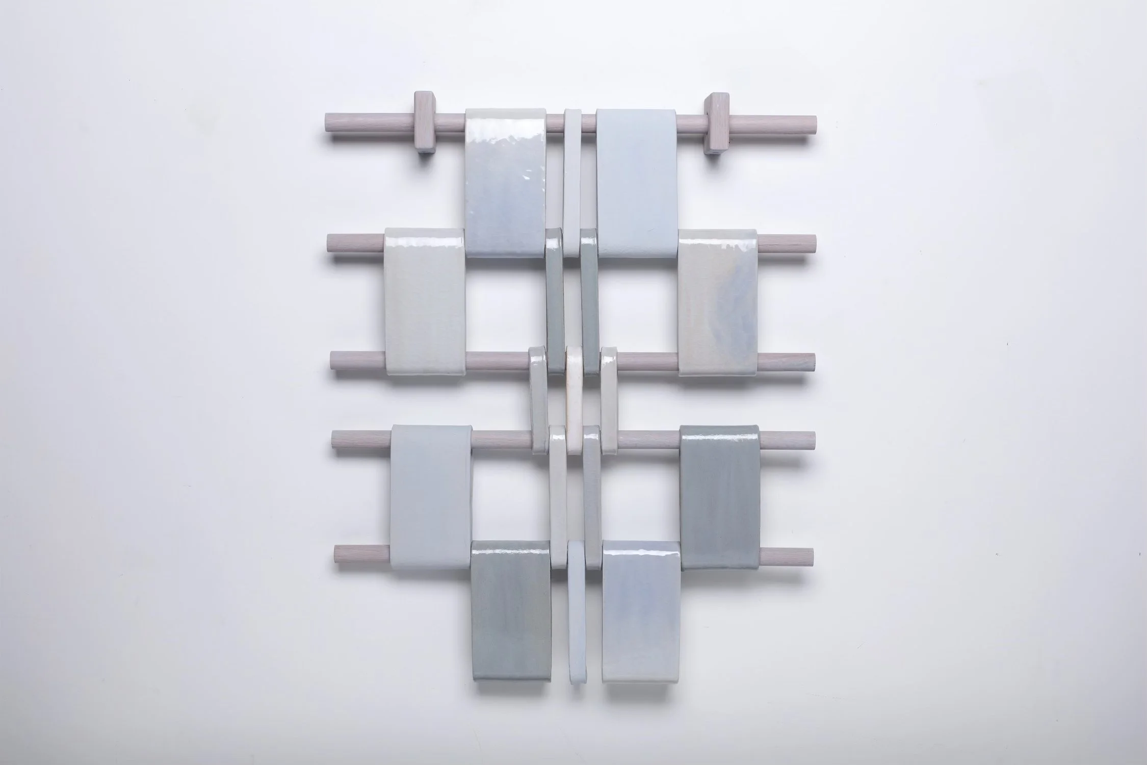 Susan McKinney, Cloud Ice, 2025, stained and sculpture stoneware, glazed, hung from wooden supports, 26 x 30 1/2 in.  