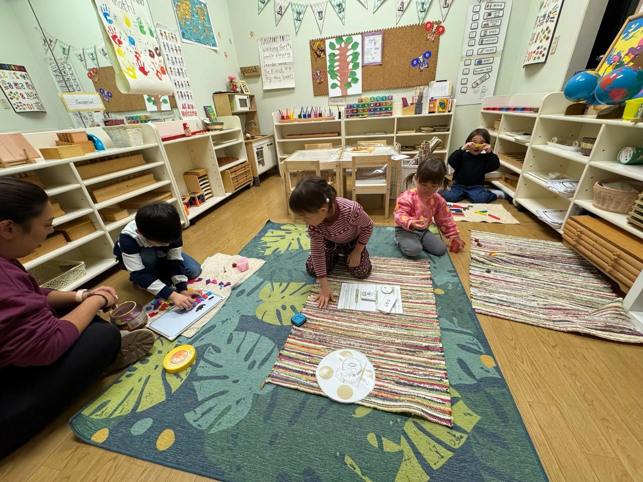 Children engaged in independent Montessori work at a preschool in Setagaya, Tokyo