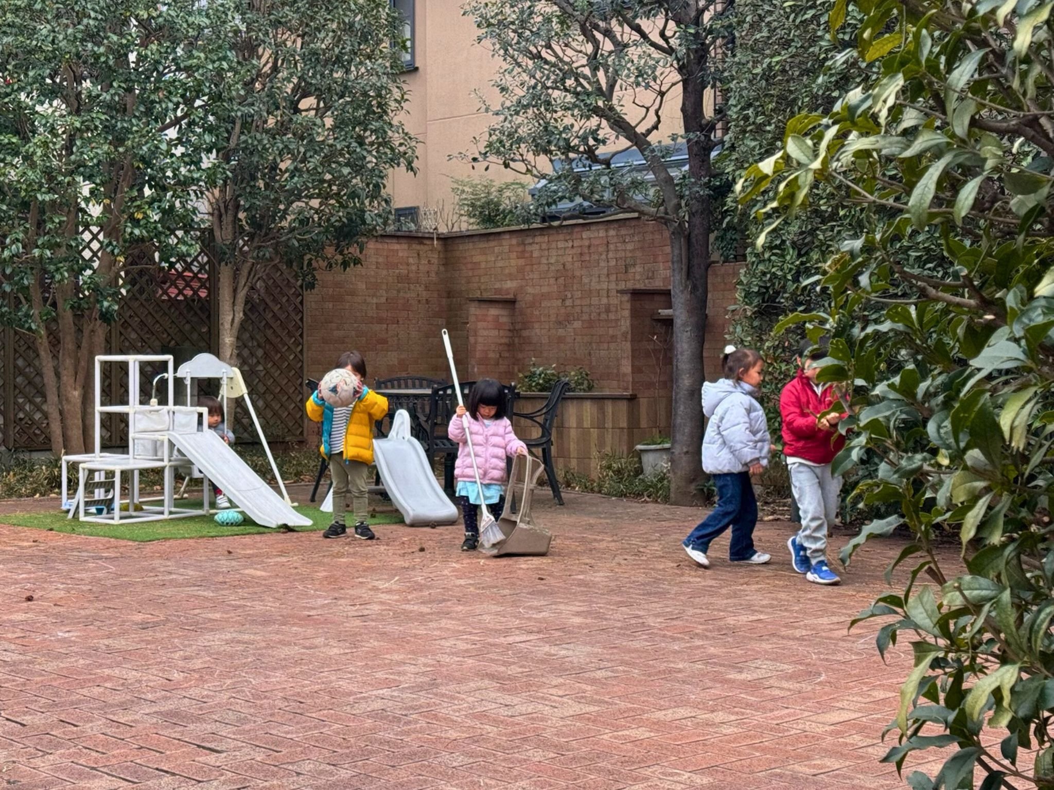 Children engaged in independent Montessori work at a preschool in Setagaya, Tokyo