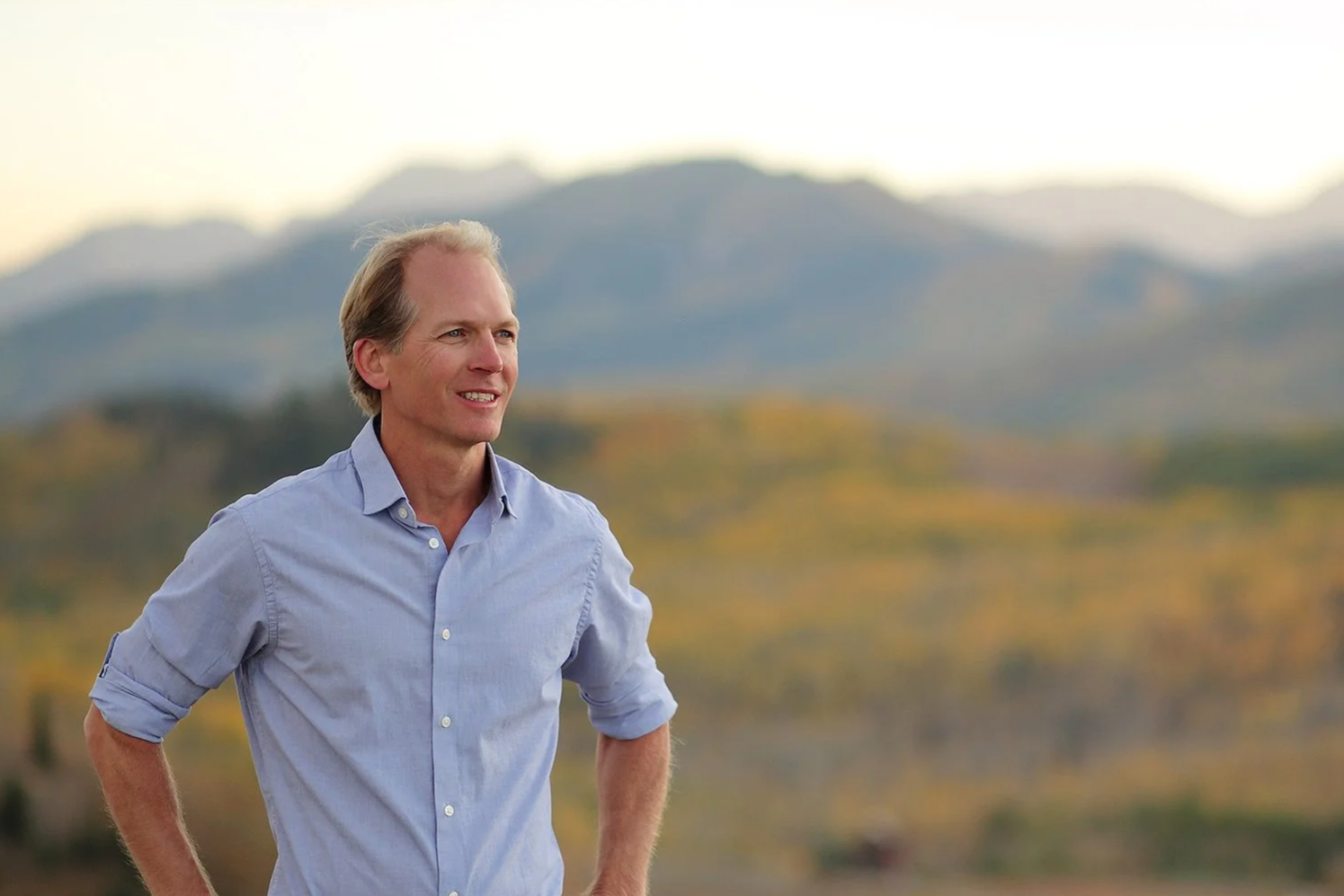 Scott Kelly breathwork facilitator and transformative coach overlooking Park City Utah mountains in autumn