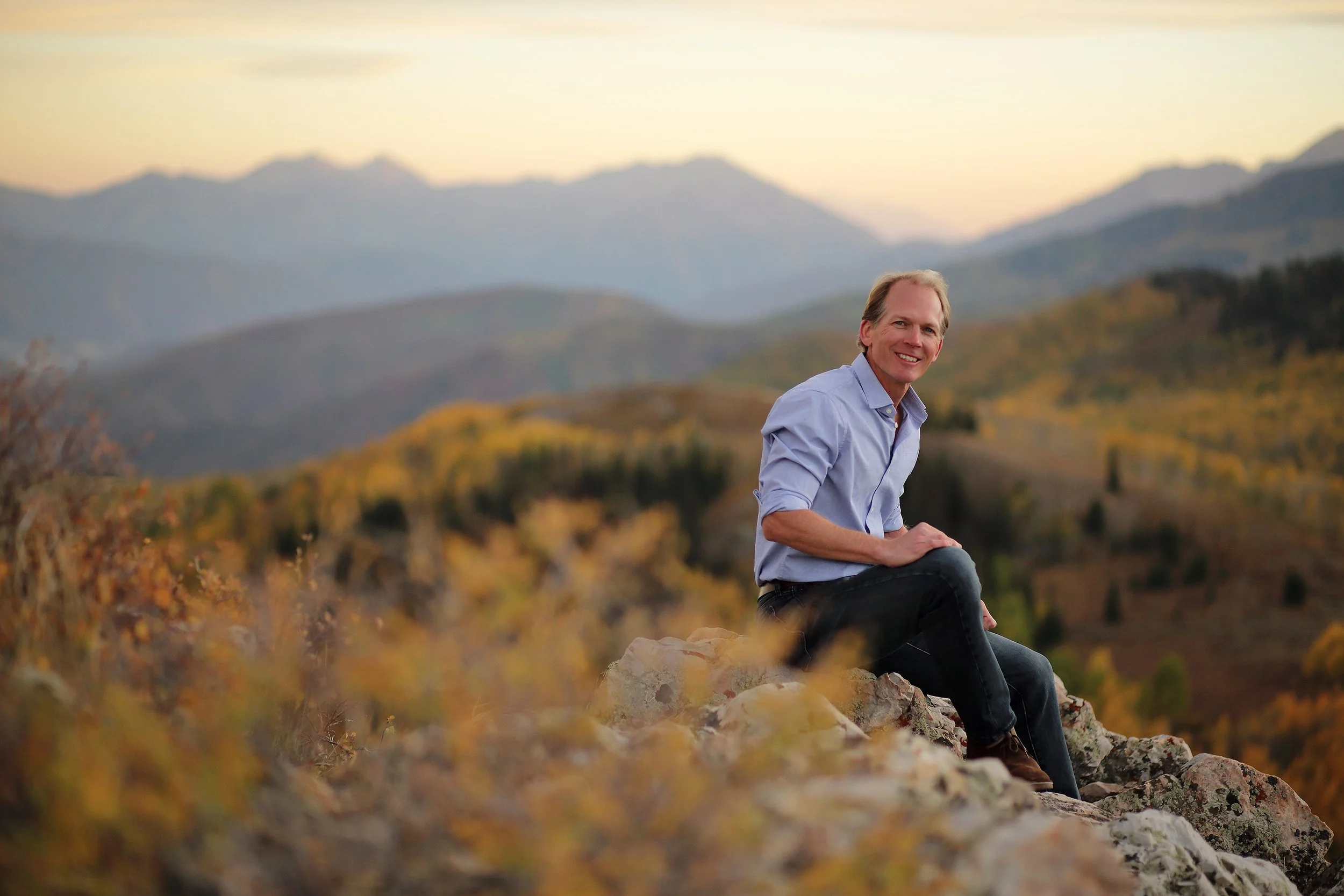 Scott Kelly transformative coach seated outdoors in Park City Utah mountains