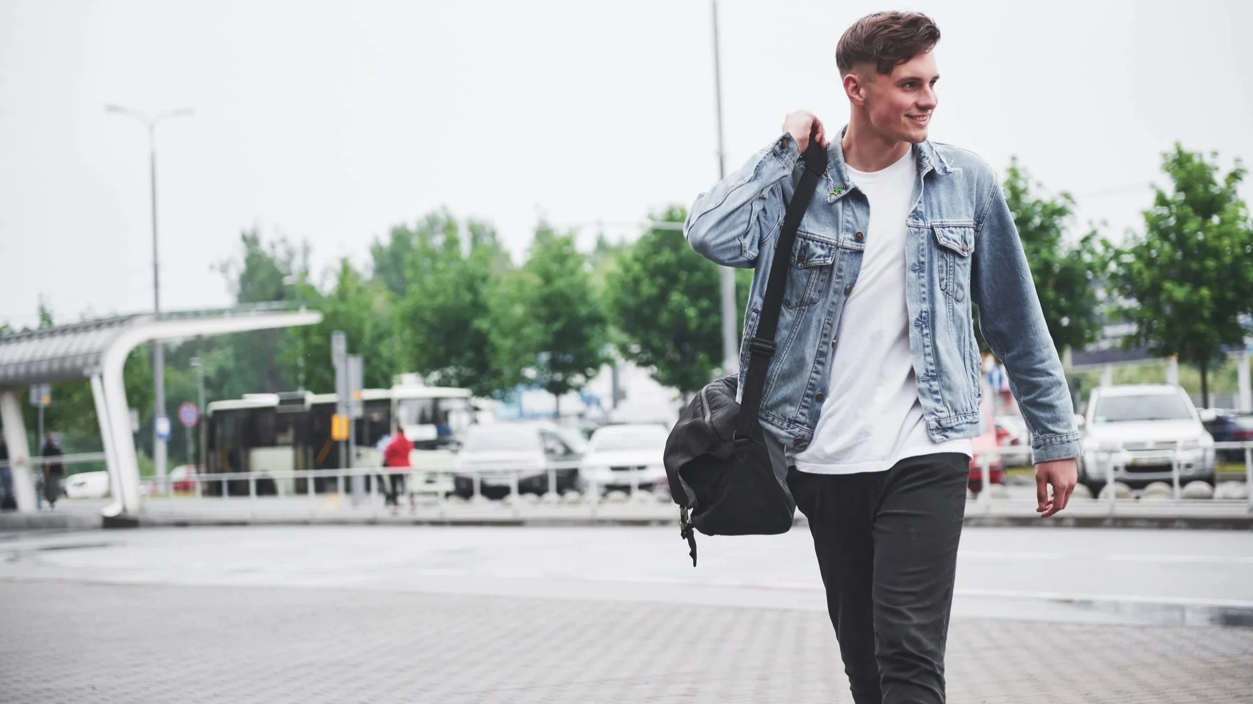Adult walking outdoors with relaxed posture in an urban environment
