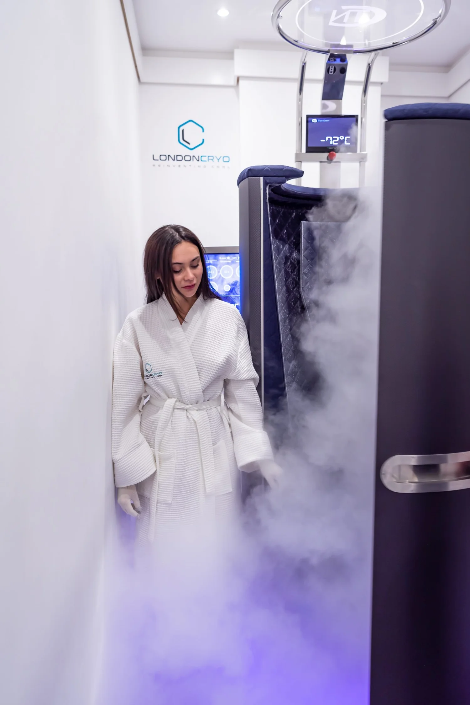 Client stepping out of the whole-body cryotherapy cabin at LondonCryo St John's Wood
