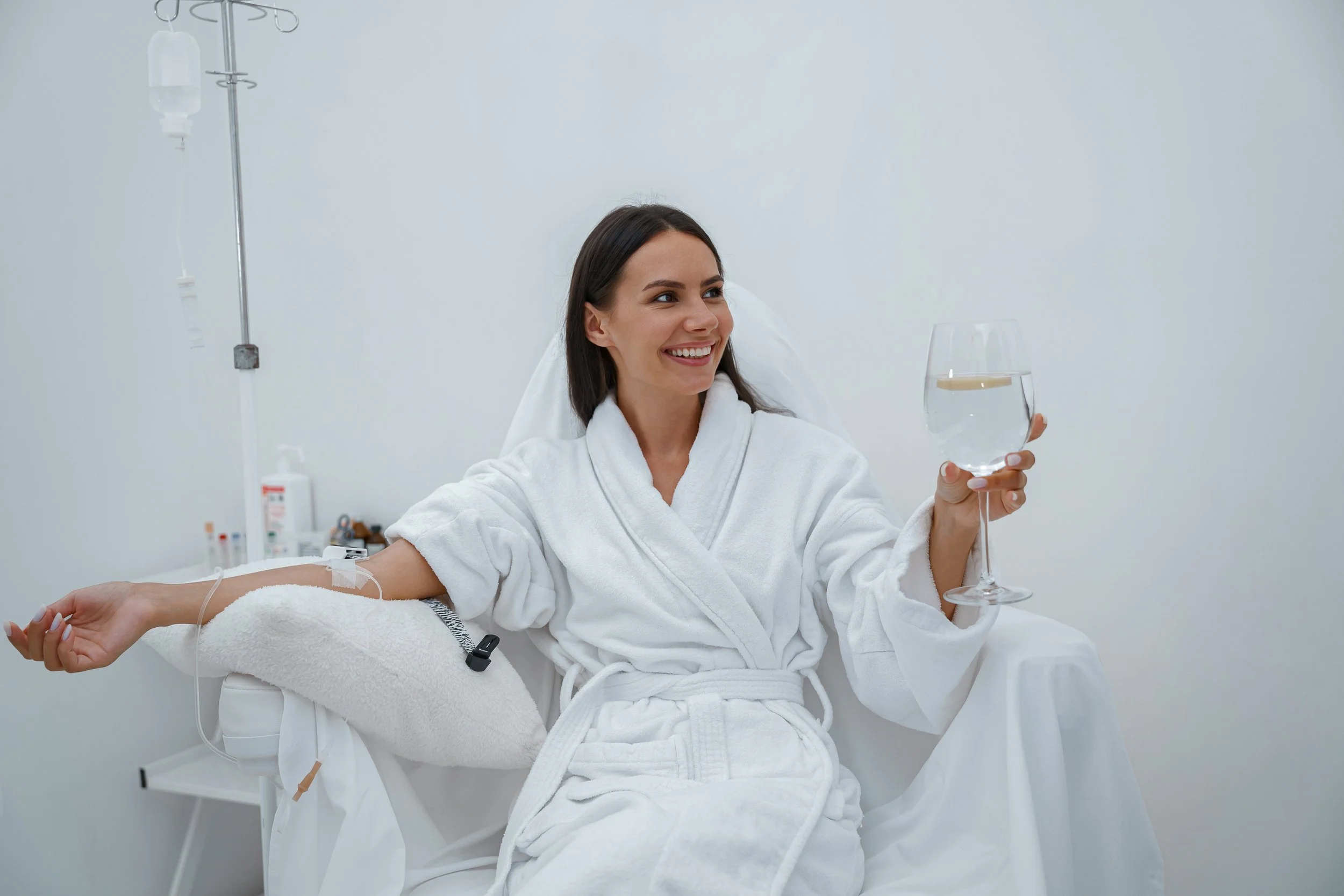 beautiful-woman-white-bathrobe-drink-water-medical-procedure-beauty-clinic (1).jpg