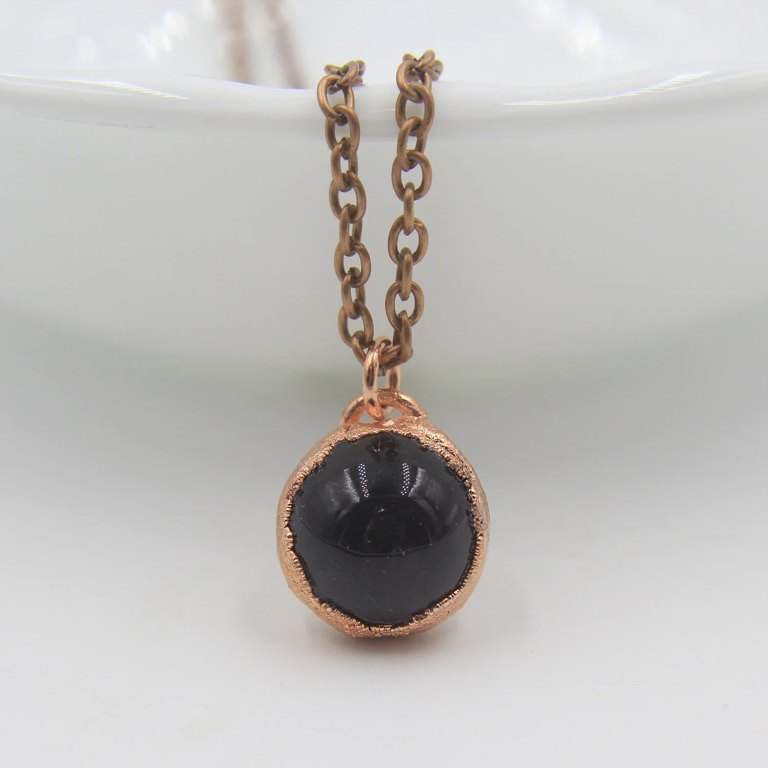 Amethyst copper necklace on display