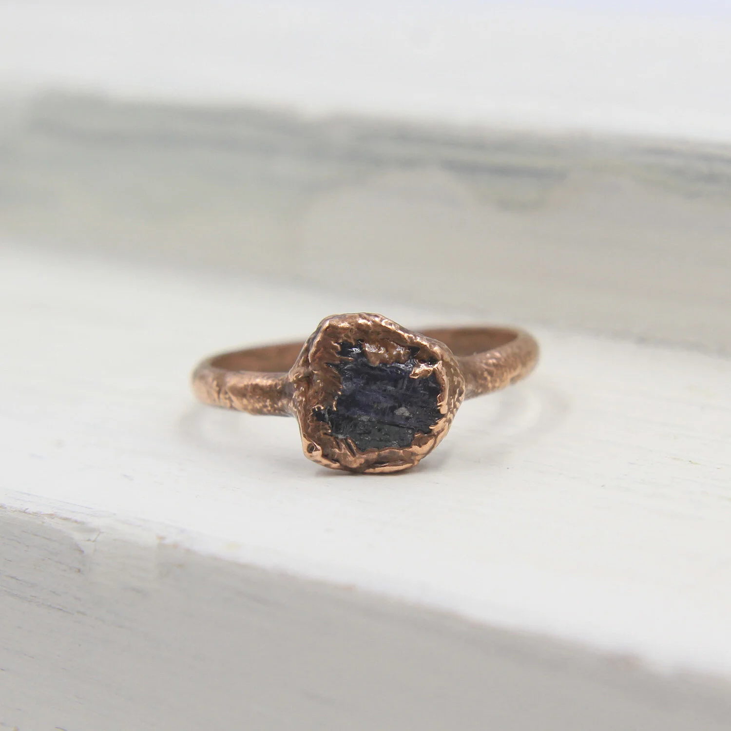 Tanzanite electroformed copper ring on display