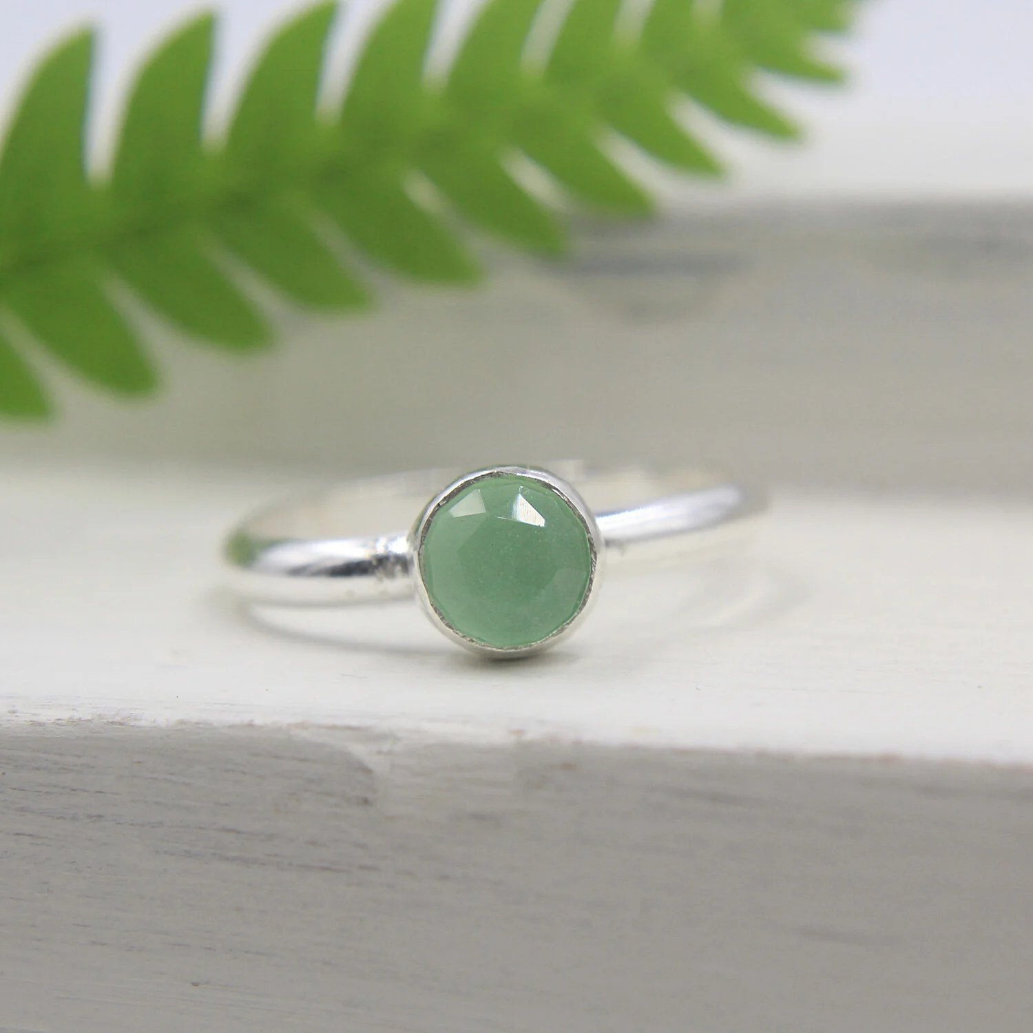 Lime chalcedony sterling silver ring on display