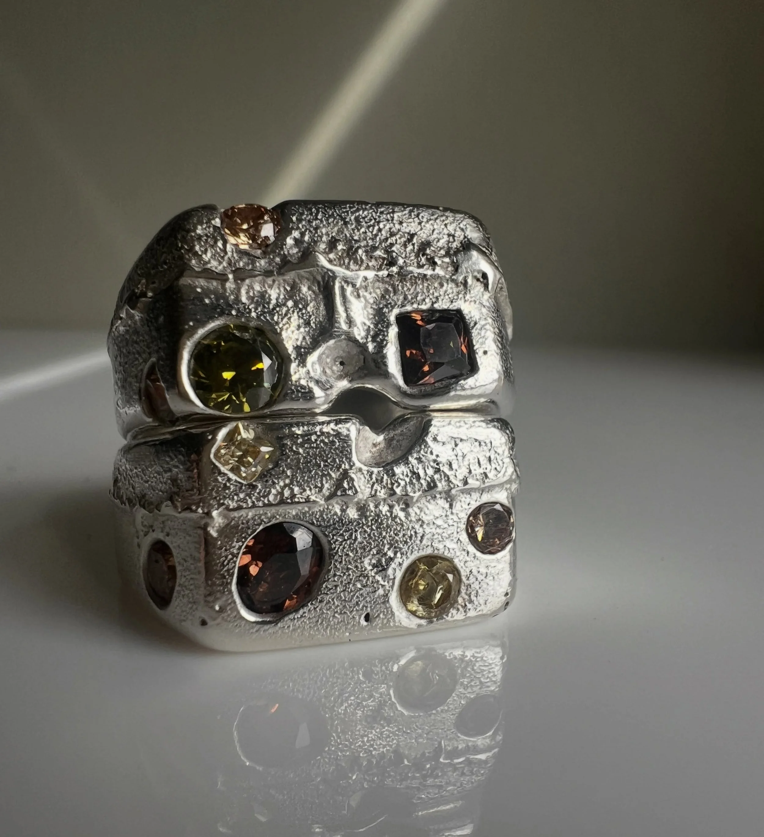 Obsessed with this colour combo. 
Organic, flowy, one of a kind , molten silver Unearthed rings with lab grown gemstones 

#zaratahirjewellery 
#sandcast
#moltenring 
#moltenmetal 
#ooak