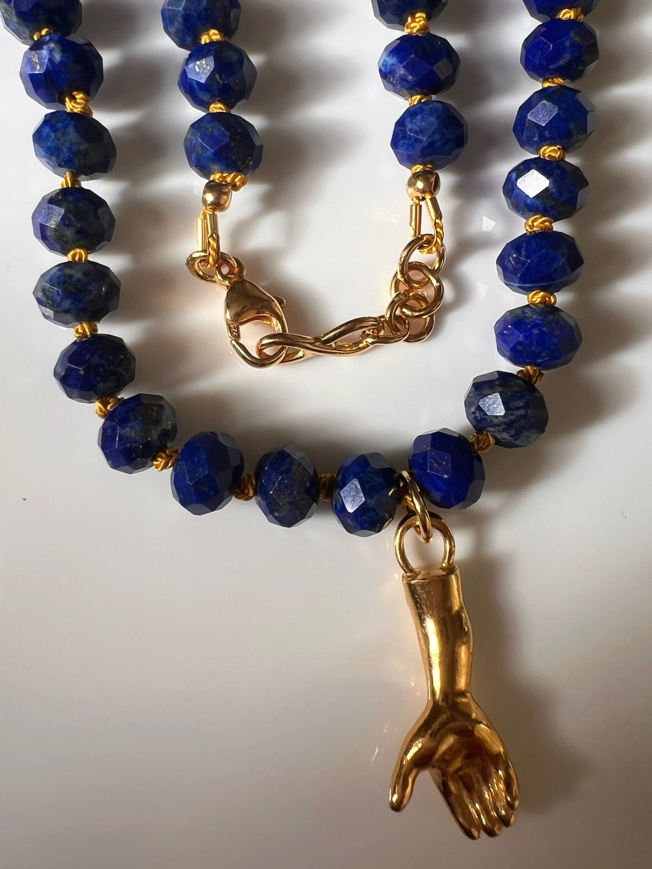 I love Lapis Lazuli . That deep blue with flecks of gold. I think it looks gorgeous with my Hand of Hope Pendant. I like to think of it as a sign of hope and strength. 

#zaratahirjewellery 
#lapislazuli 
#goldhand
#beaded 
#gemstonenecklace