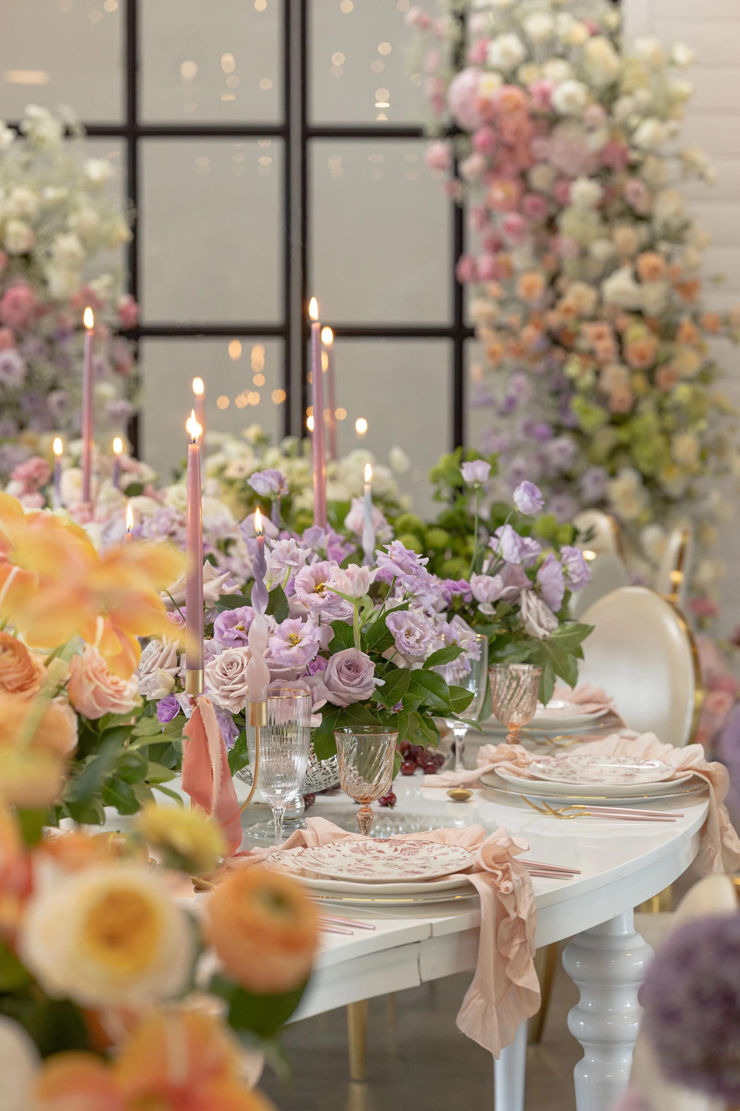 elegant-colorful-long-table-candles-luxury-floral-design-flower-centerpieces-purple-pink-green-orange-long-table-centerpiece-wedding-event-design-florist-colors.jpg