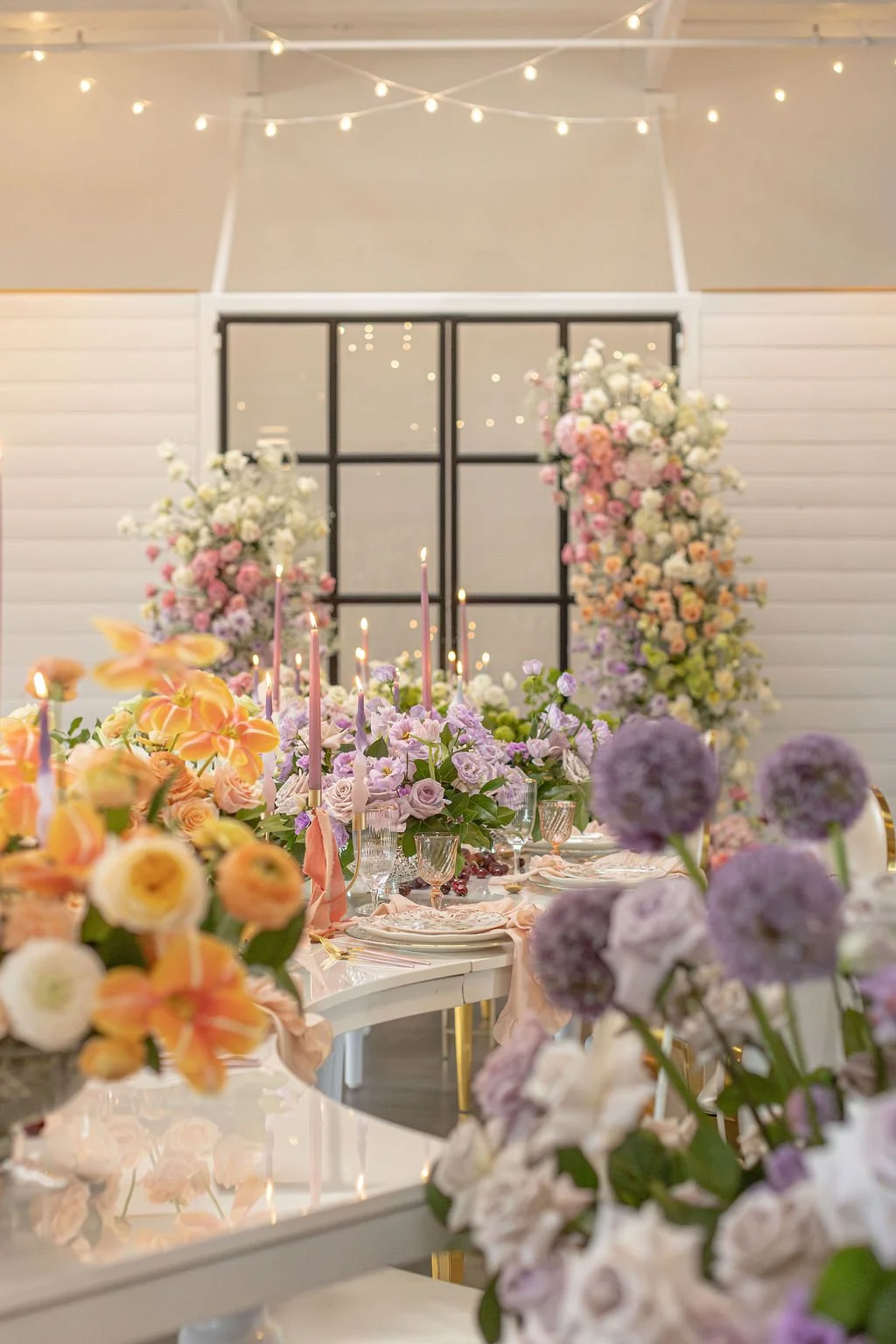 summer-colors-lush-elegant-colorful-long-table-candles-luxury-floral-design-flower-centerpieces-purple-pink-green-orange-long-table-centerpiece-wedding-event-design-florist.jpg