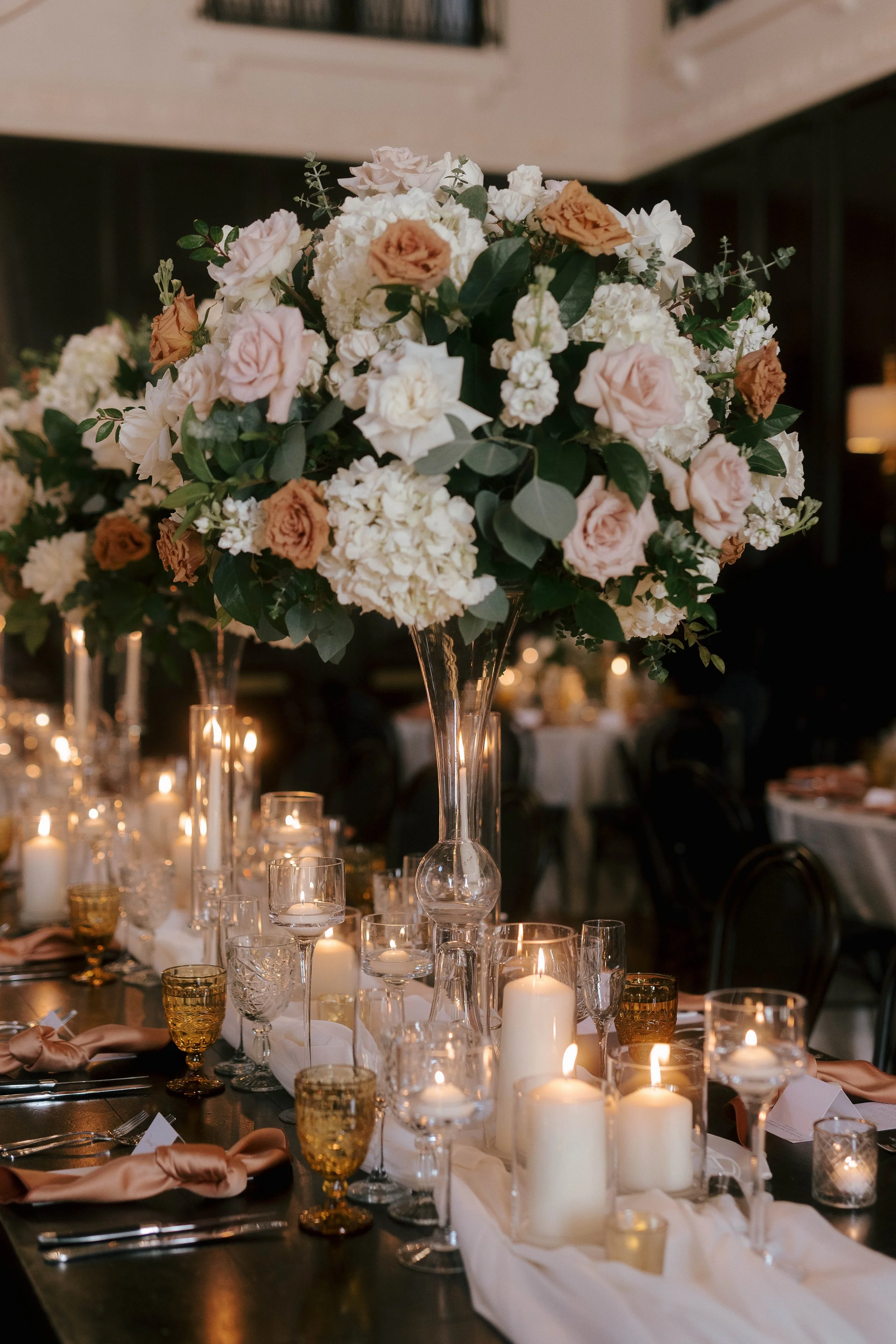 Tall wedding centerpiece with toffee roses at The Ebell Long Beach