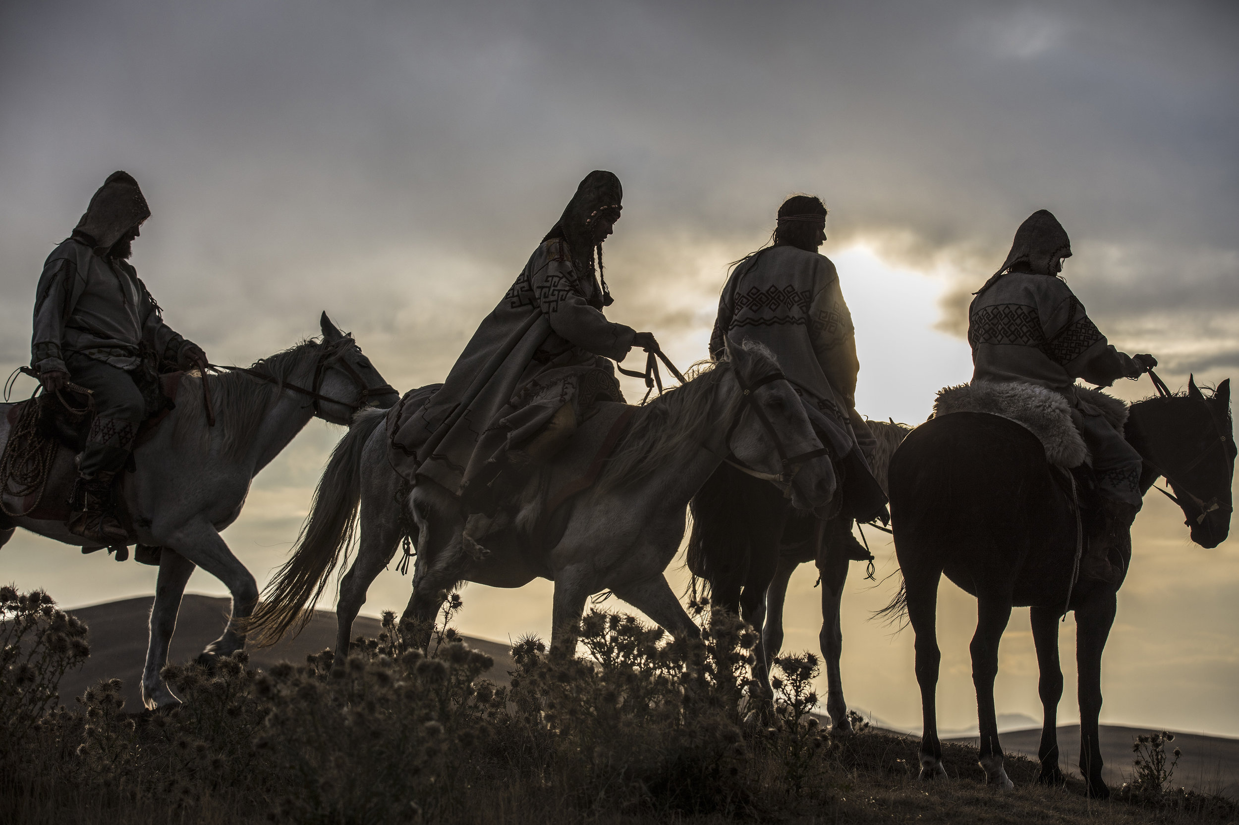 Yamnaya men and women on horseback, sunset.jpg