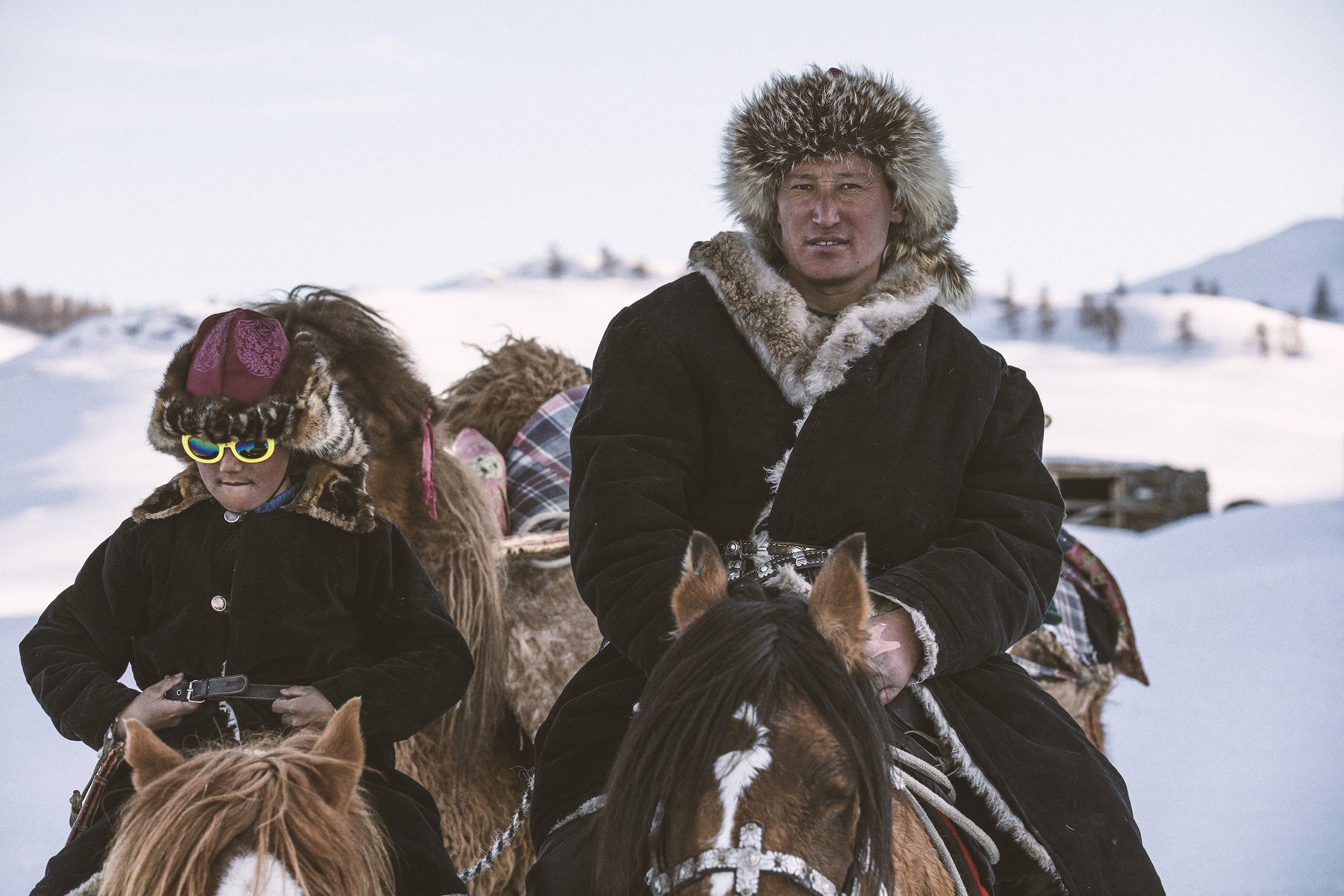 Janibek (L) with his father Auez on the winter migration, Mongolia Altai_BOY_NOMAD_aAron_Munson.jpg