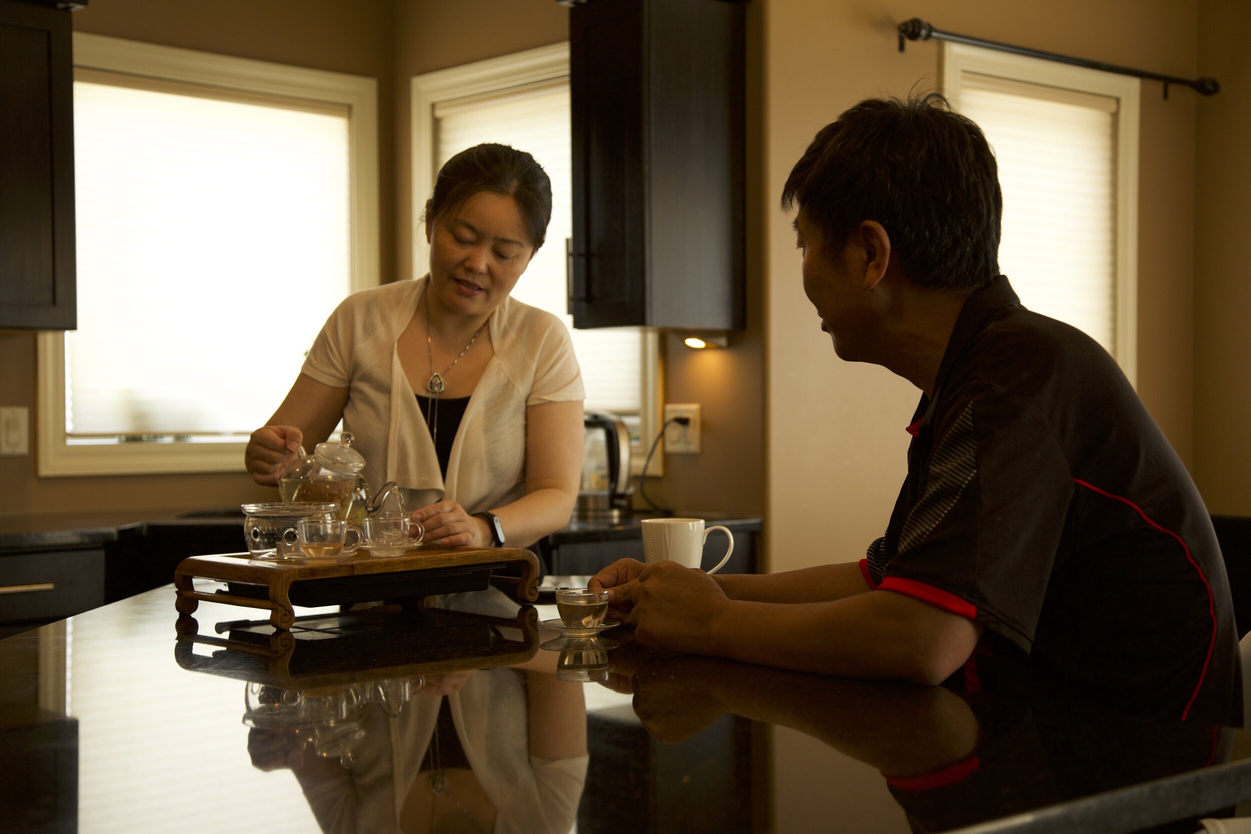 Farmland - David Fu and his wife Lillie Gao discuss farm matters over tea.jpg