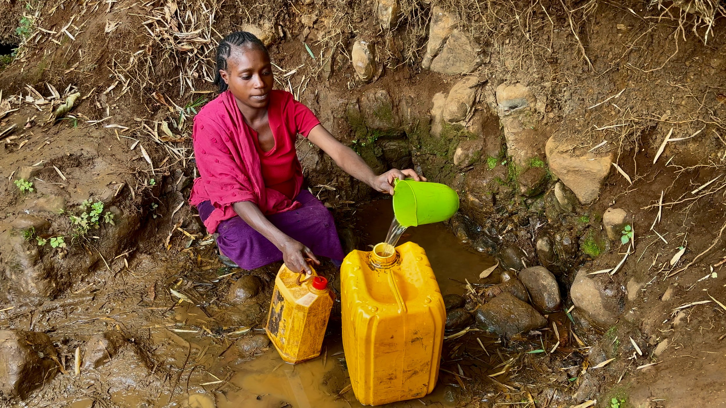 The-Struggle-for-Mother-Water-01-Ethiopian-Woman-Fetching-Contaminated-Water.jpg