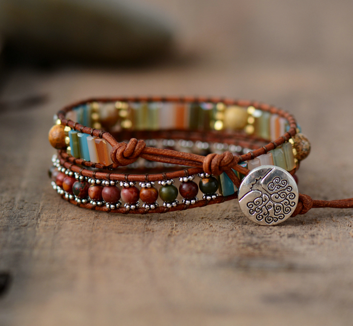 boho wraps tree of life tibetan silver closure. Beautiful protective jasper stone beads in 7 chakra healing colors. Brown genuine leather wrap bohemian jewelry with confidence beads. adjustable sizing