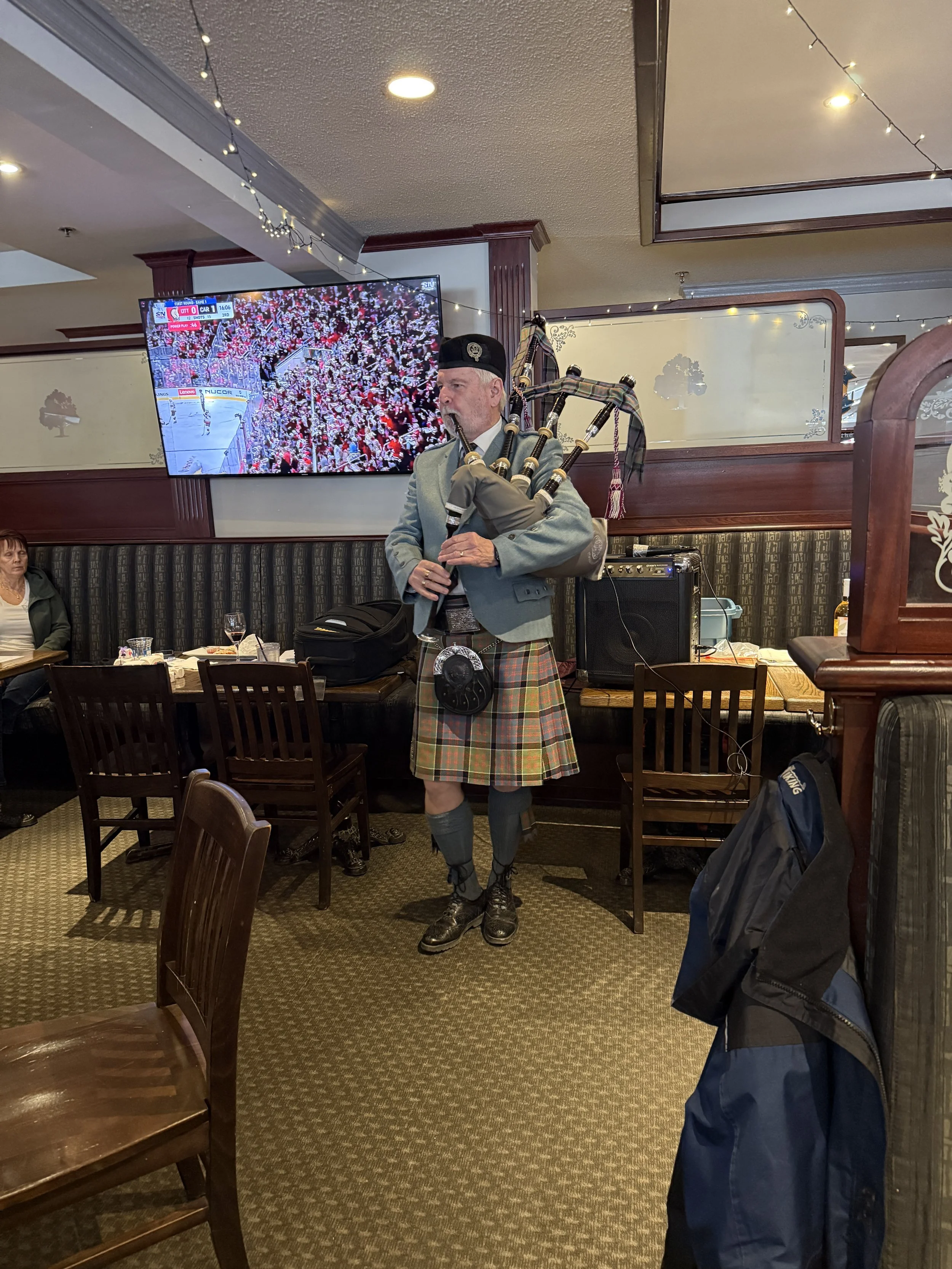 Piper Donald plays the pipes