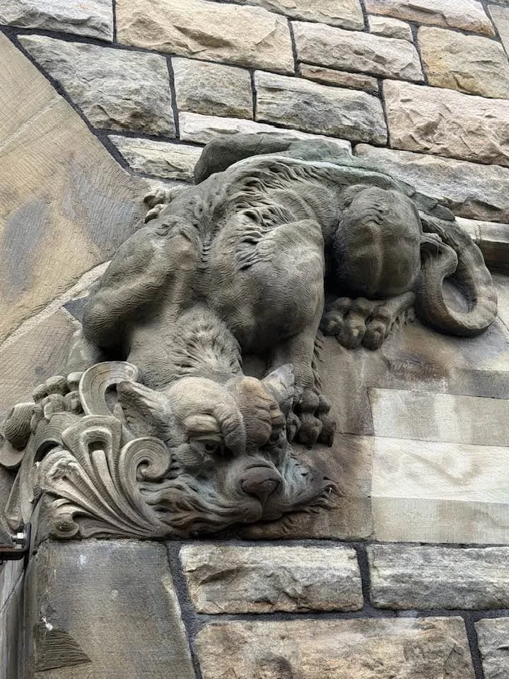 One of the carved cats over the door of the West Block