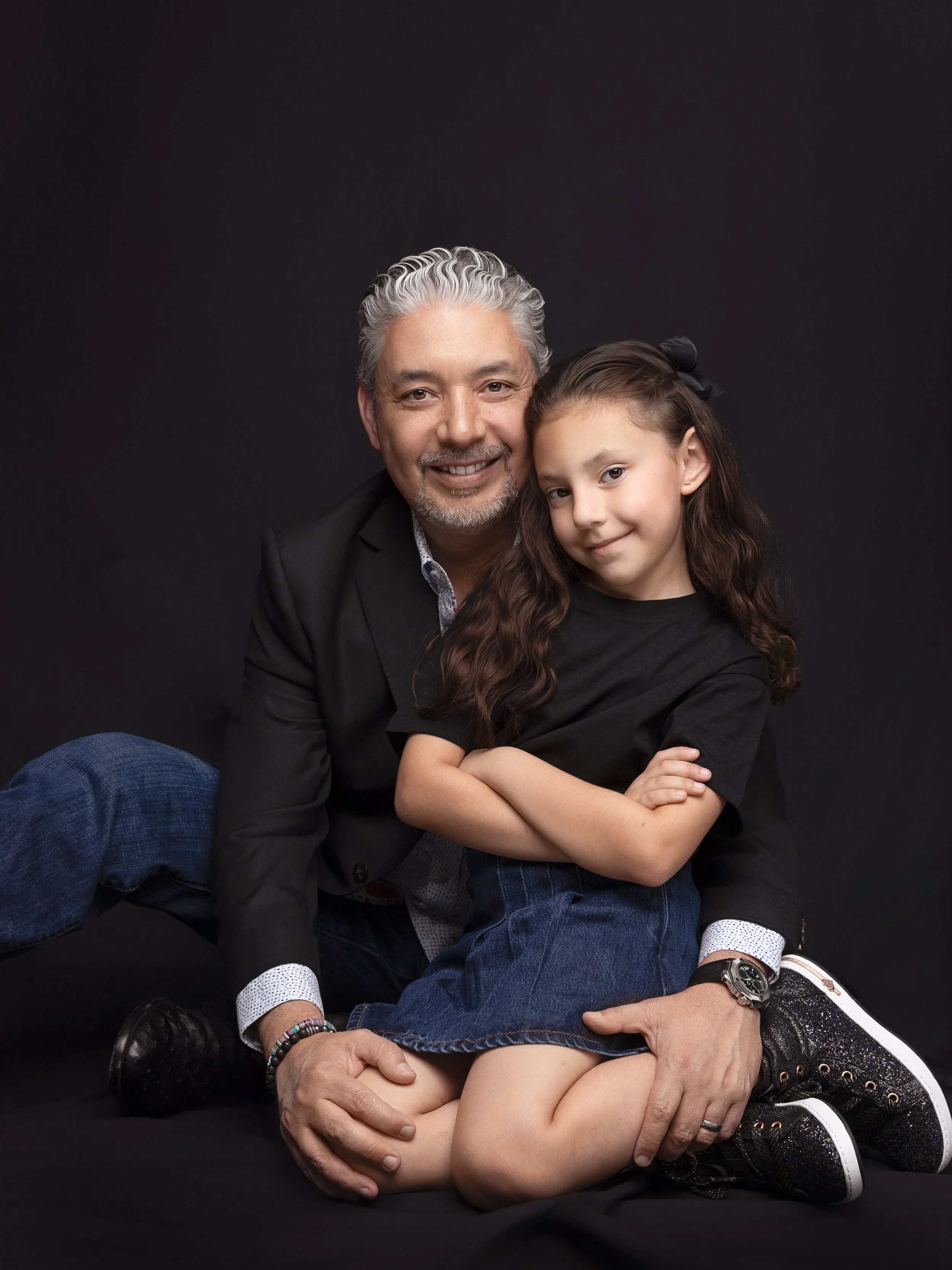 She&rsquo;s strong because he showed up.

Look at where she rests. Settled into him, arms crossed, completely at ease. This is what safe looks like on a kid.

A girl learns what she&rsquo;s worth partly from the first man who loves her well. He&rsquo