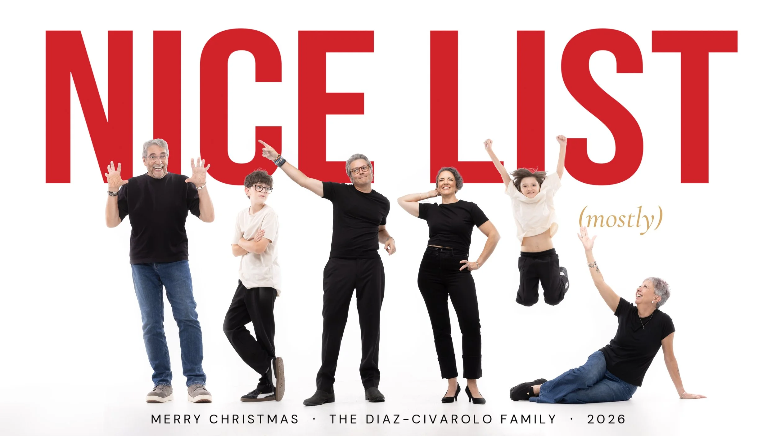 Custom Christmas card with NICE LIST in bold red letters behind a playful family of six posing on a white studio backdrop, McAllen TX family photographer