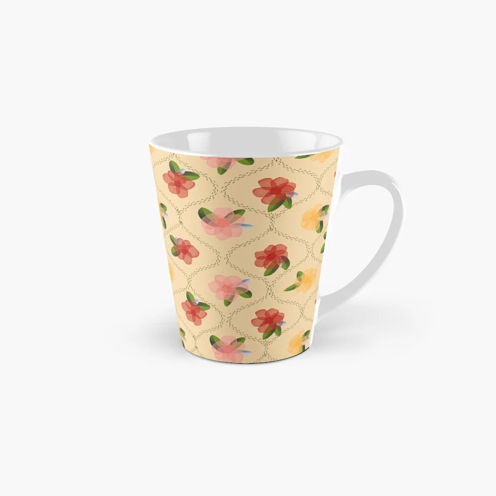 mug with yellow background, alternating pink, red, and cream coloured abstract watercolour flowers with green leaves to accompany books on creativity