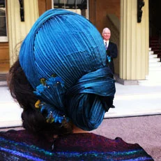 A big thank you to Terri who sent in this picture of her husband's investiture at Buckingham Palace. For this very special occasion, Terri chose a limited edition version of my TURBAN headpiece in a deep turquoise pleated silk, embellished with tiny Lady Amherst pheasant feathers.