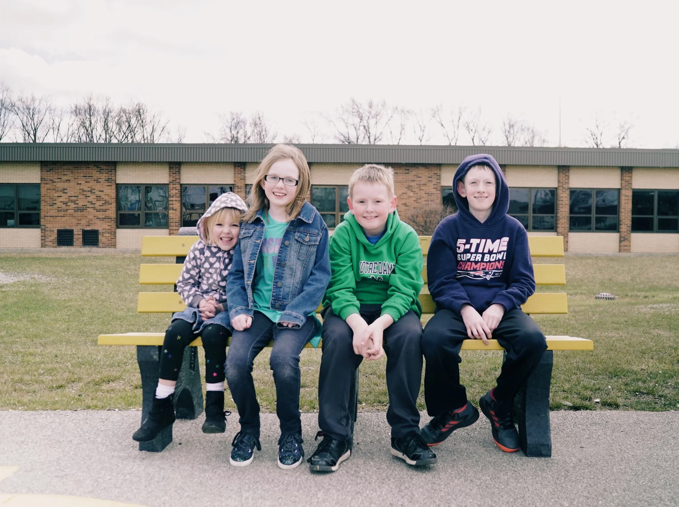 Sammie and siblings on buddy bench.jpg