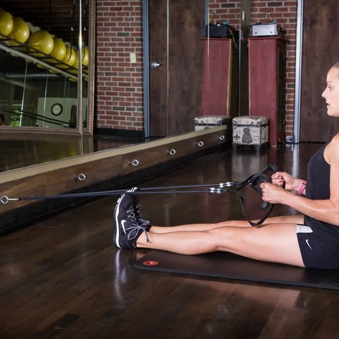 Anchor to the floor to maximize and isolate specific body areas.