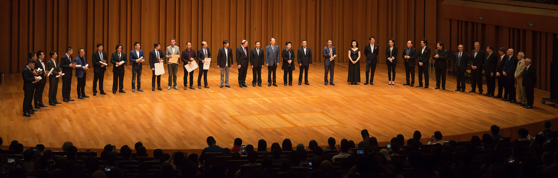Award winners of the 4th China International Violin and Bow Making Competition on stage at the National Centre for the Performing Arts (NCPA) in Beijing.