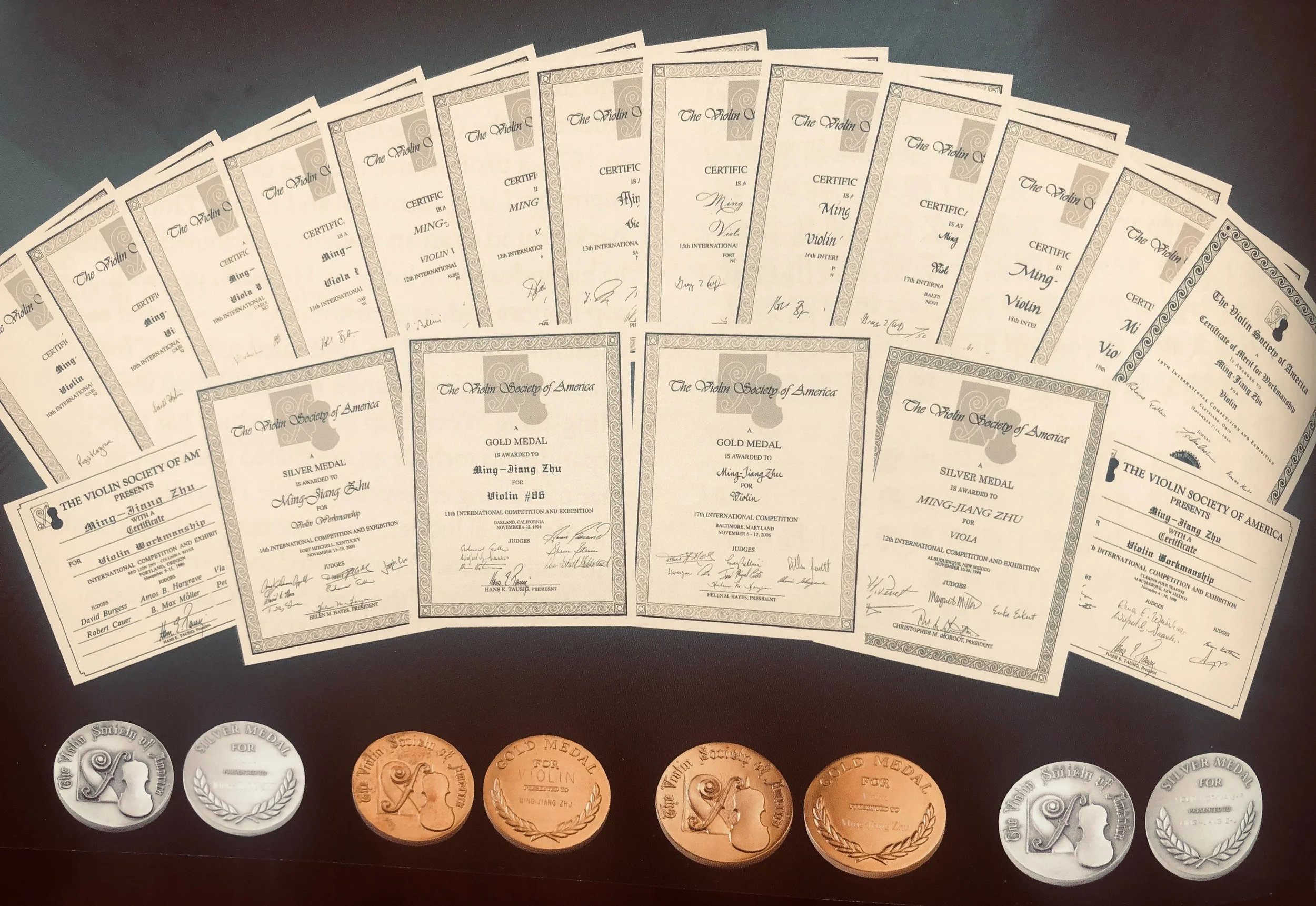 Awards from the violin society of america (vsa0 competition awarded to master chinese violinmaker Ming-Jiang Zhu (朱明江)