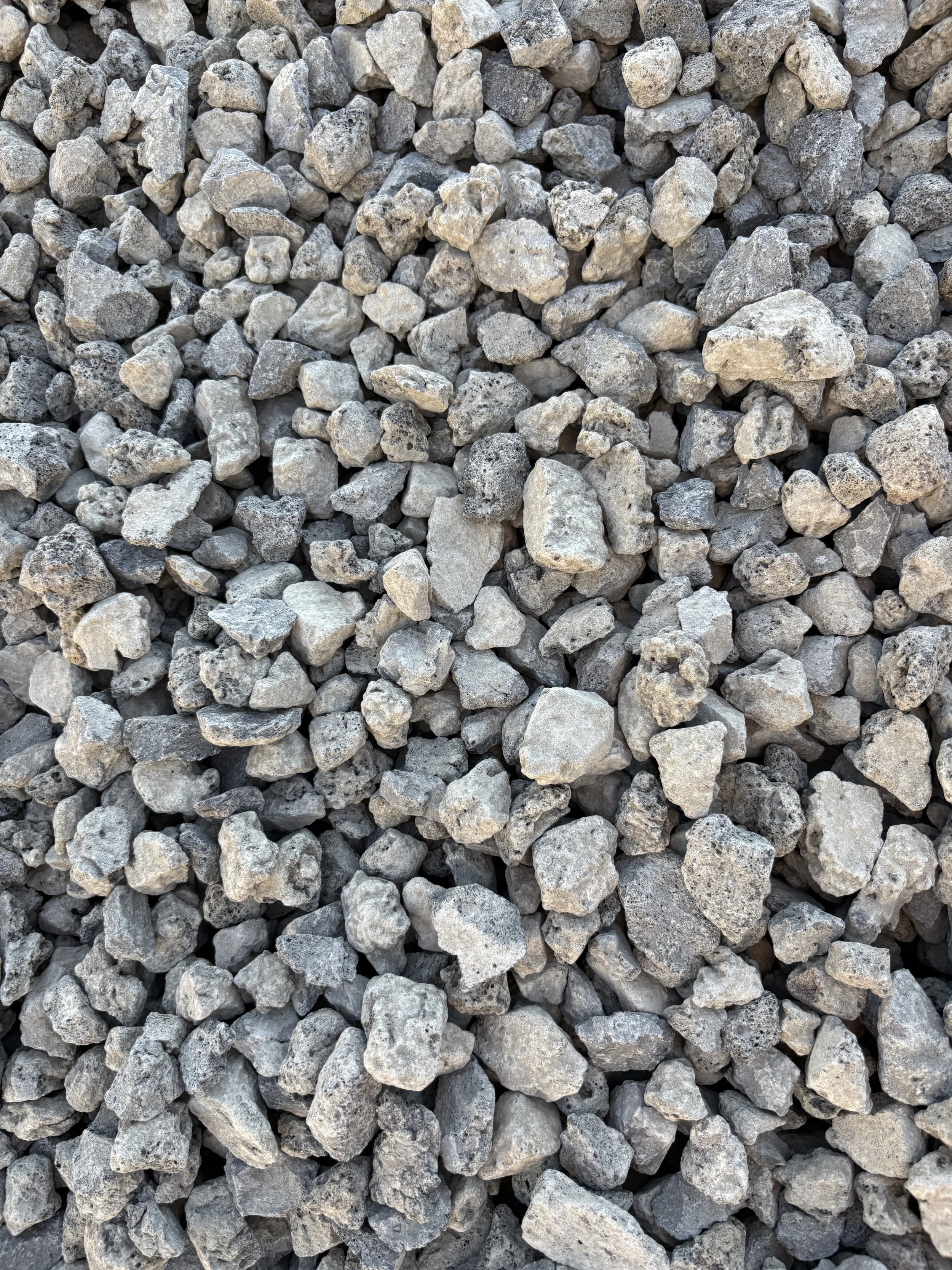A large pile of small to medium gray gravel stones.