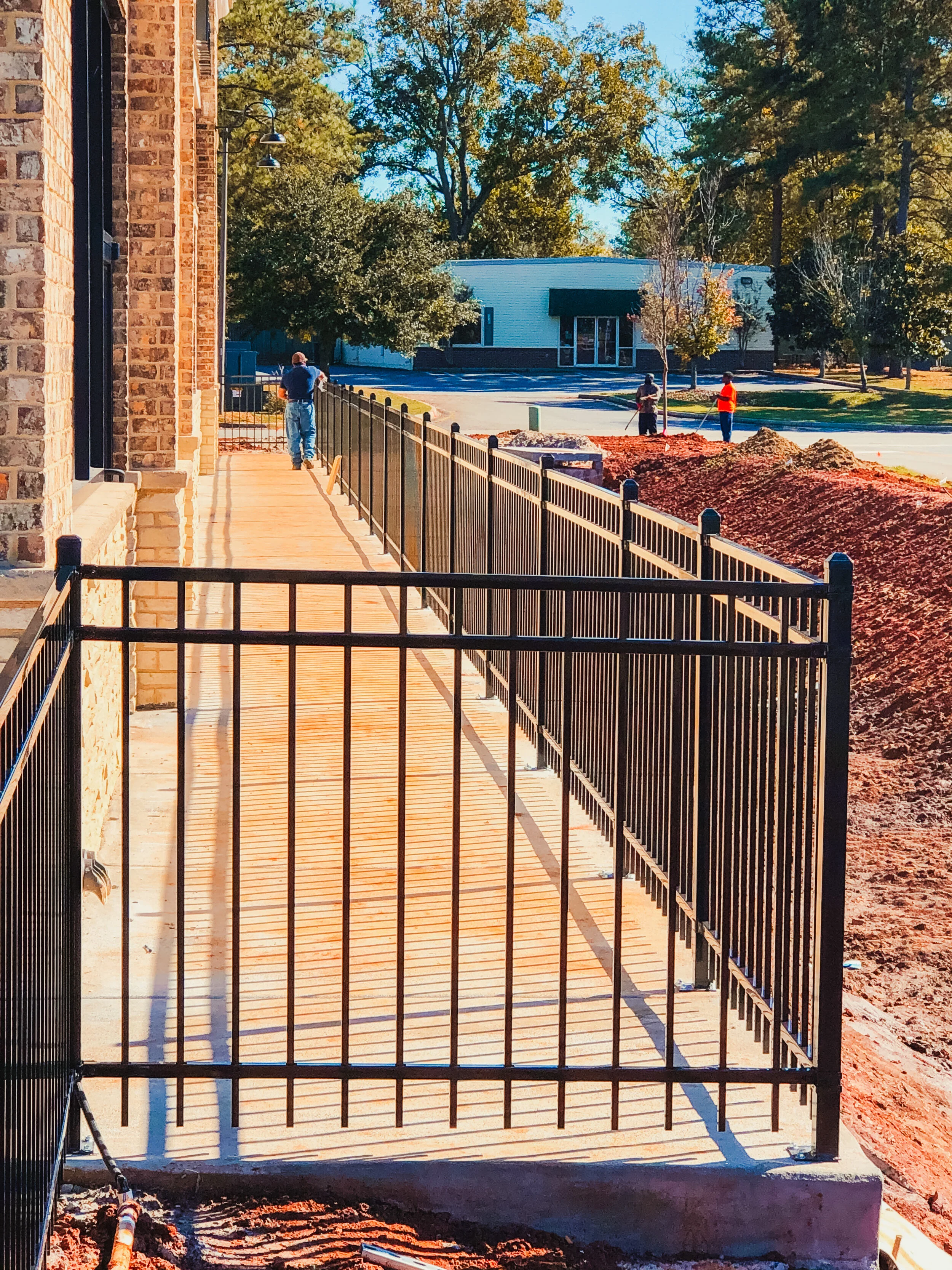 ornamental aluminum fence in concrete.jpeg