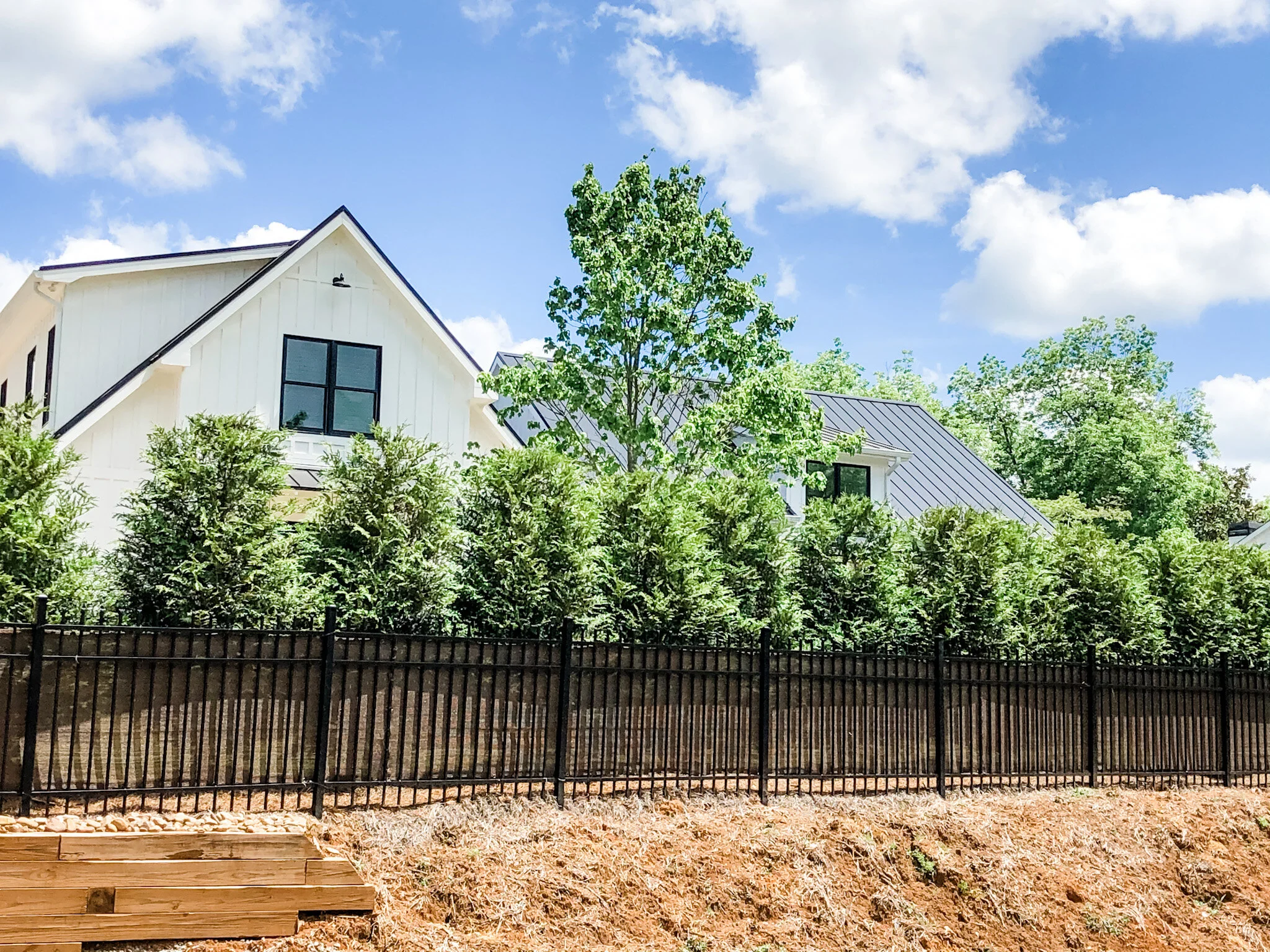 ornamental steel aluminum fence with windscreen privacy screen.jpeg