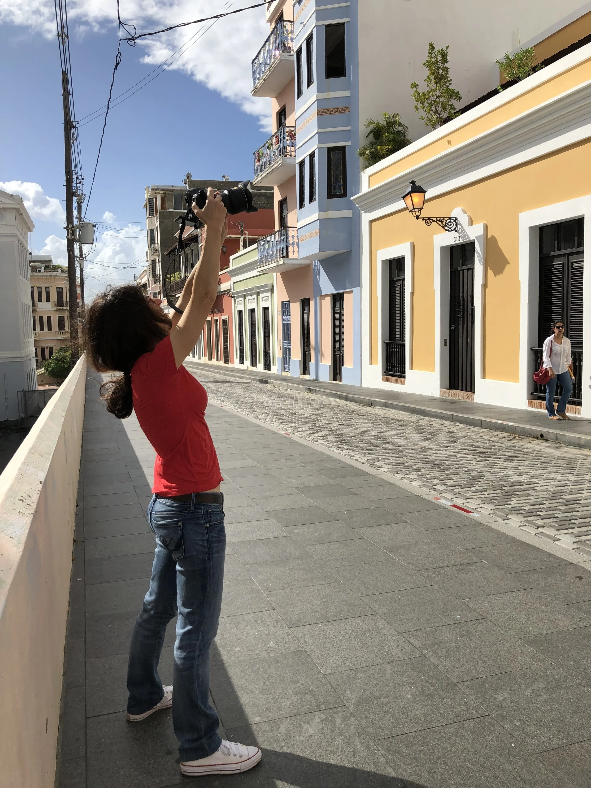 Frances Negrón-Muntaner taking a photo of Rafael Codero’s home and school. (Photo: Maggie de la Cuesta)