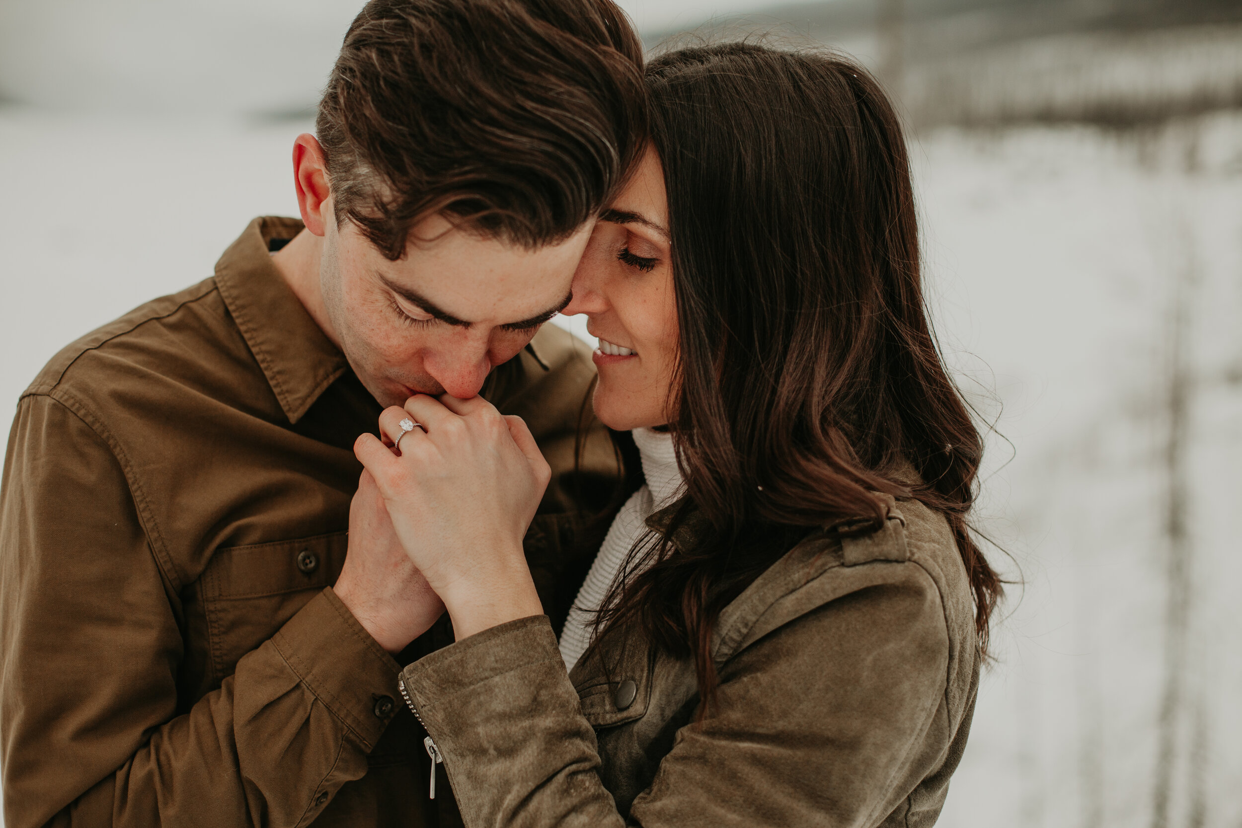 Man kissing woman's hand  | Jamie Robson Photography | Engagement Photographer in Jasper (Copy)