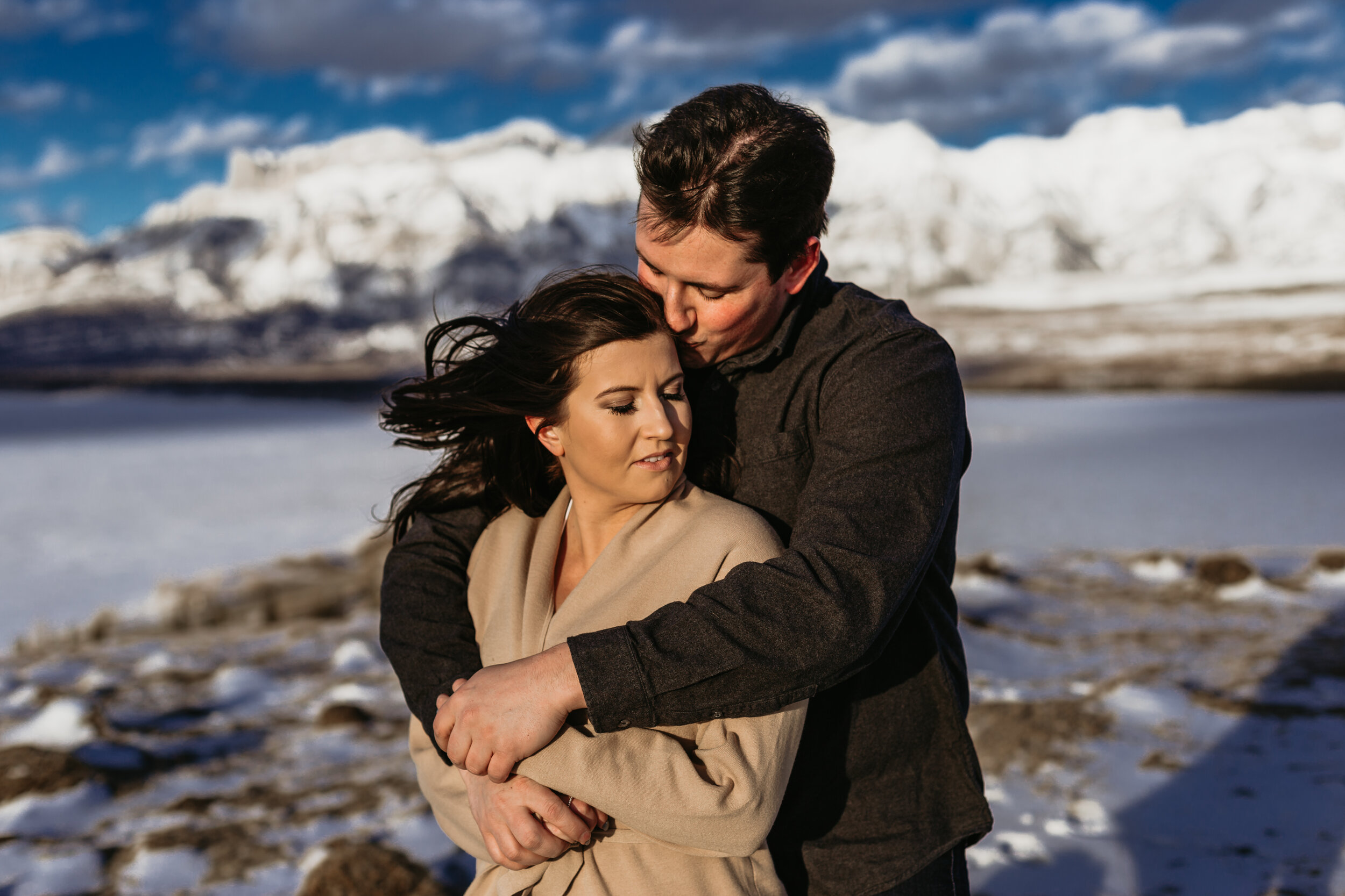 couple hugging on a mountaintop  | Jamie Robson Photography | Engagement Photographer in Jasper (Copy)
