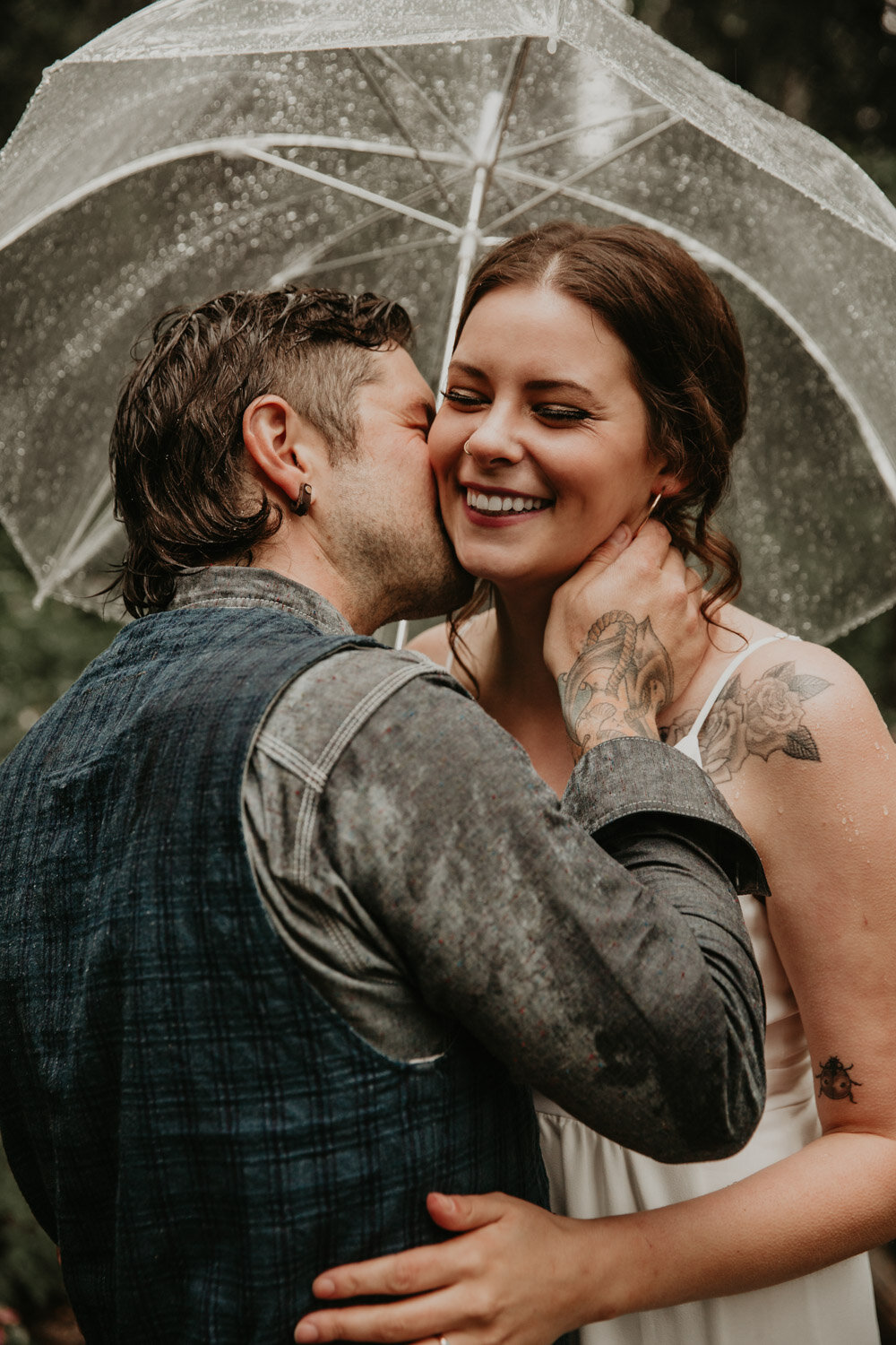 Bride & Groom laughing in the rainBride & Groom in the Rocky Mountains | Jamie Robson Photography | Elopement & Wedding Photographer in Jasper (Copy)