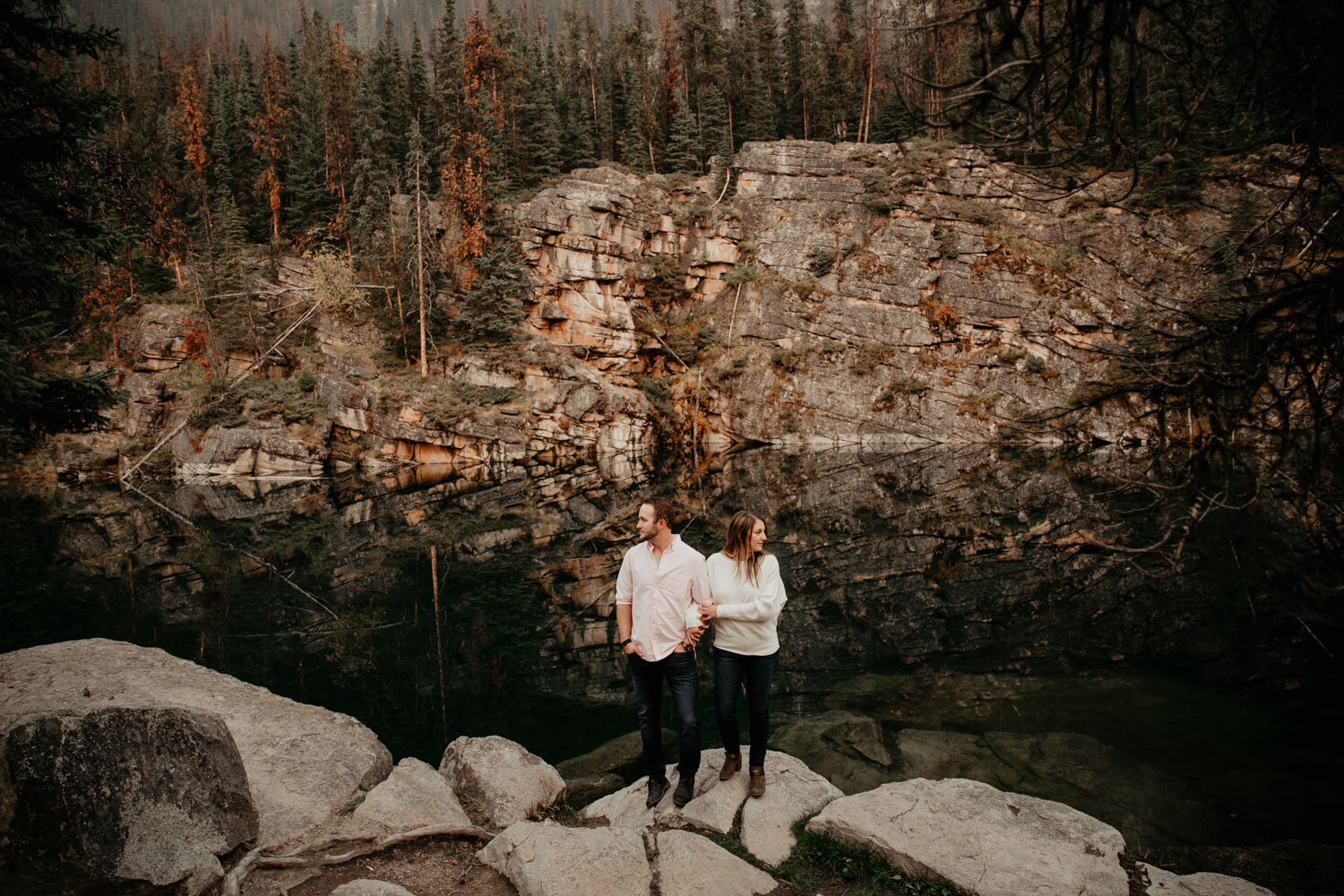 Couple with cliffs and lake | Jamie Robson Photography | Engagement Photographer in Jasper (Copy)