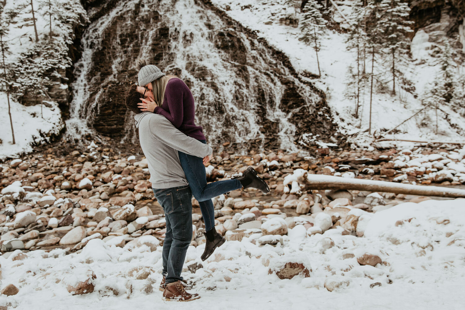 Couple Kissing in front of waterfalls | Jamie Robson Photography | Engagement Photographer in Jasper (Copy)
