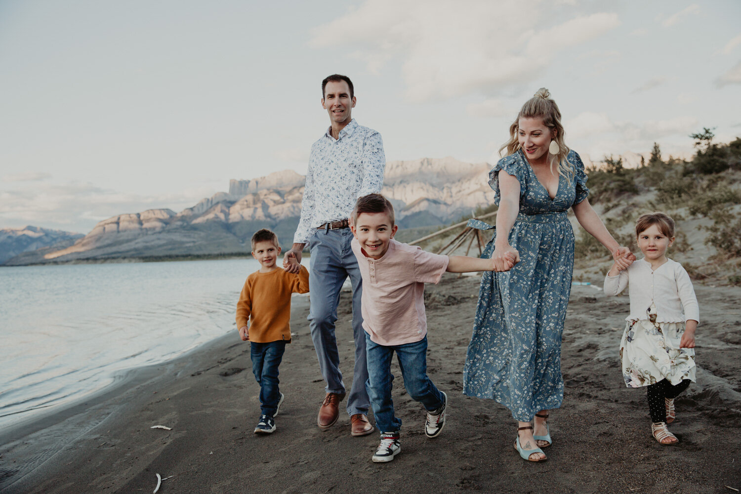 Boy pulling family in the mountains | Jamie Robson Photography | Family Photographer in Jasper (Copy)