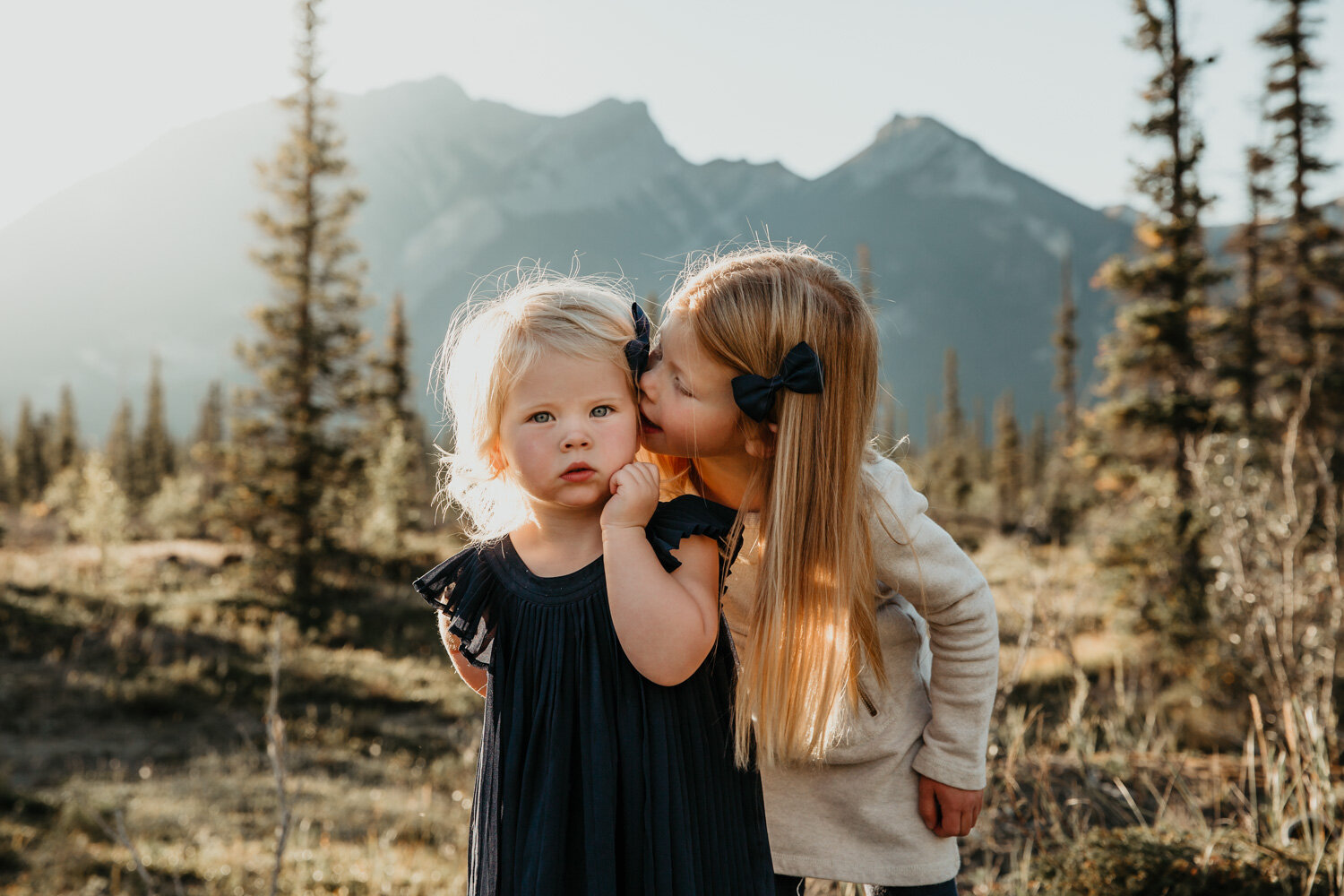 Sisters telling secrets | Jamie Robson Photography | Family Photographer in Jasper (Copy)