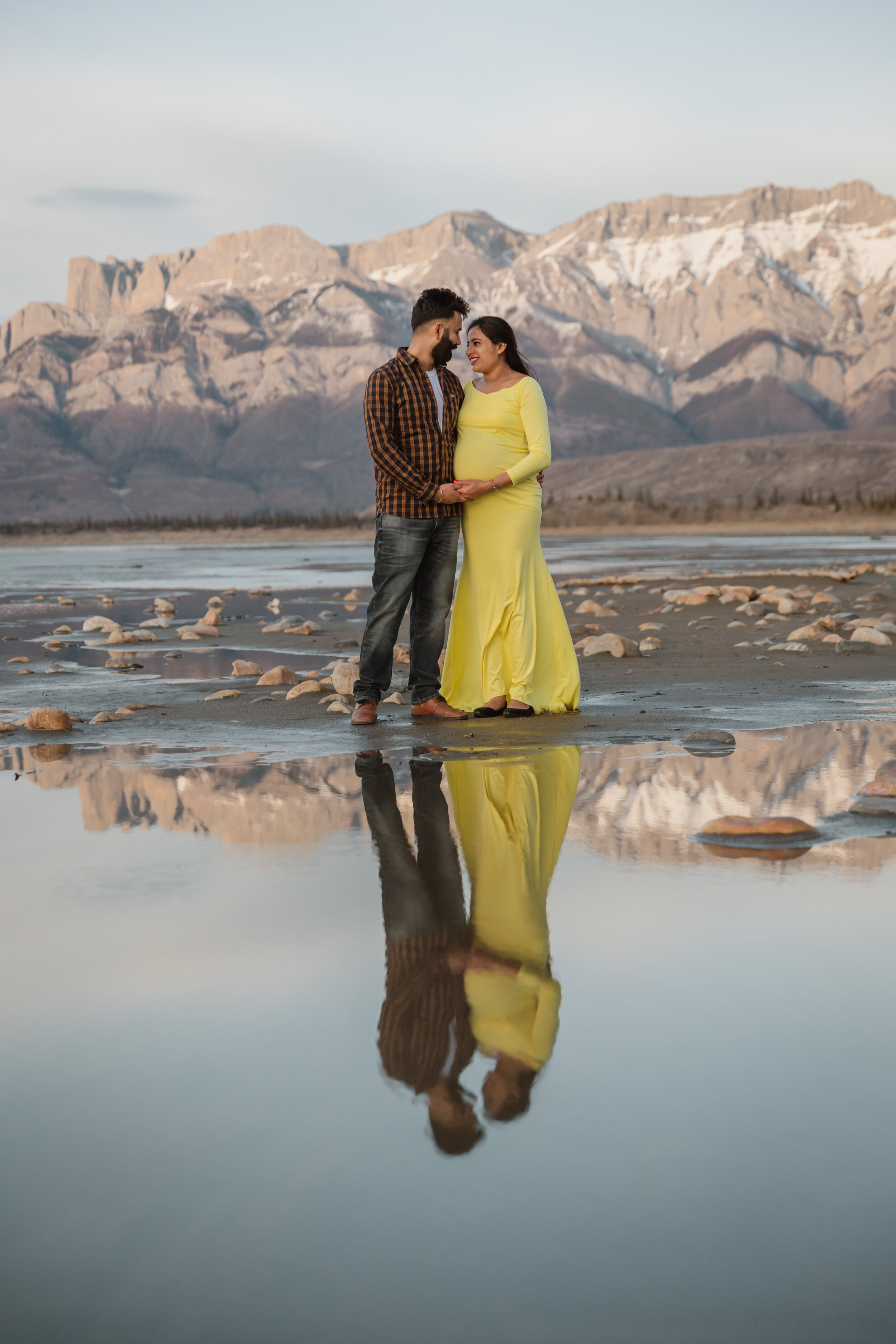 Reflection of man and woman in Jasper Lake | Jamie Robson Photography | Maternity Photographer in Jasper (Copy)
