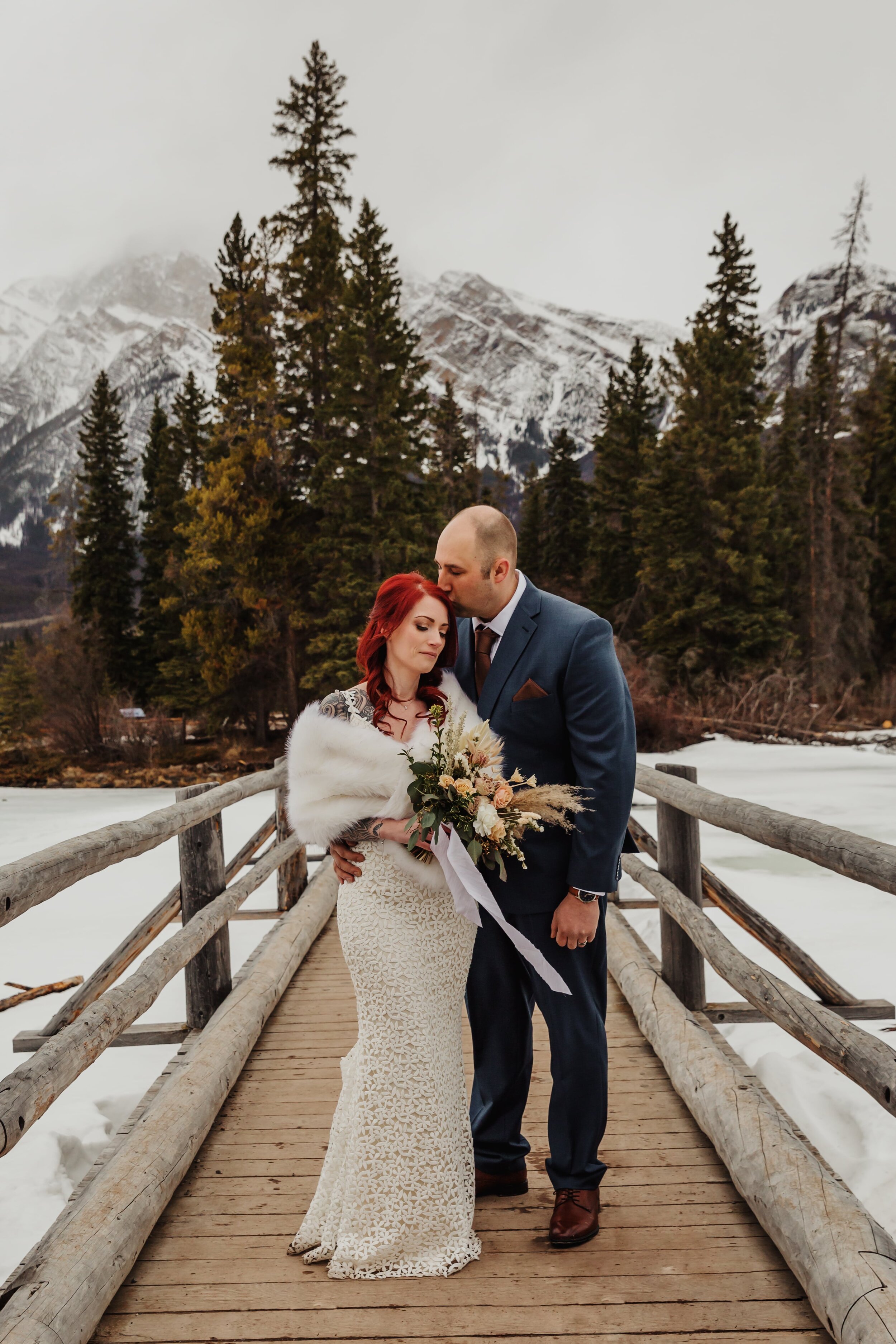 Married couple on Pyramid Island Bridge | Jamie Robson Photography | Elopement & Wedding Photographer in Jasper (Copy)